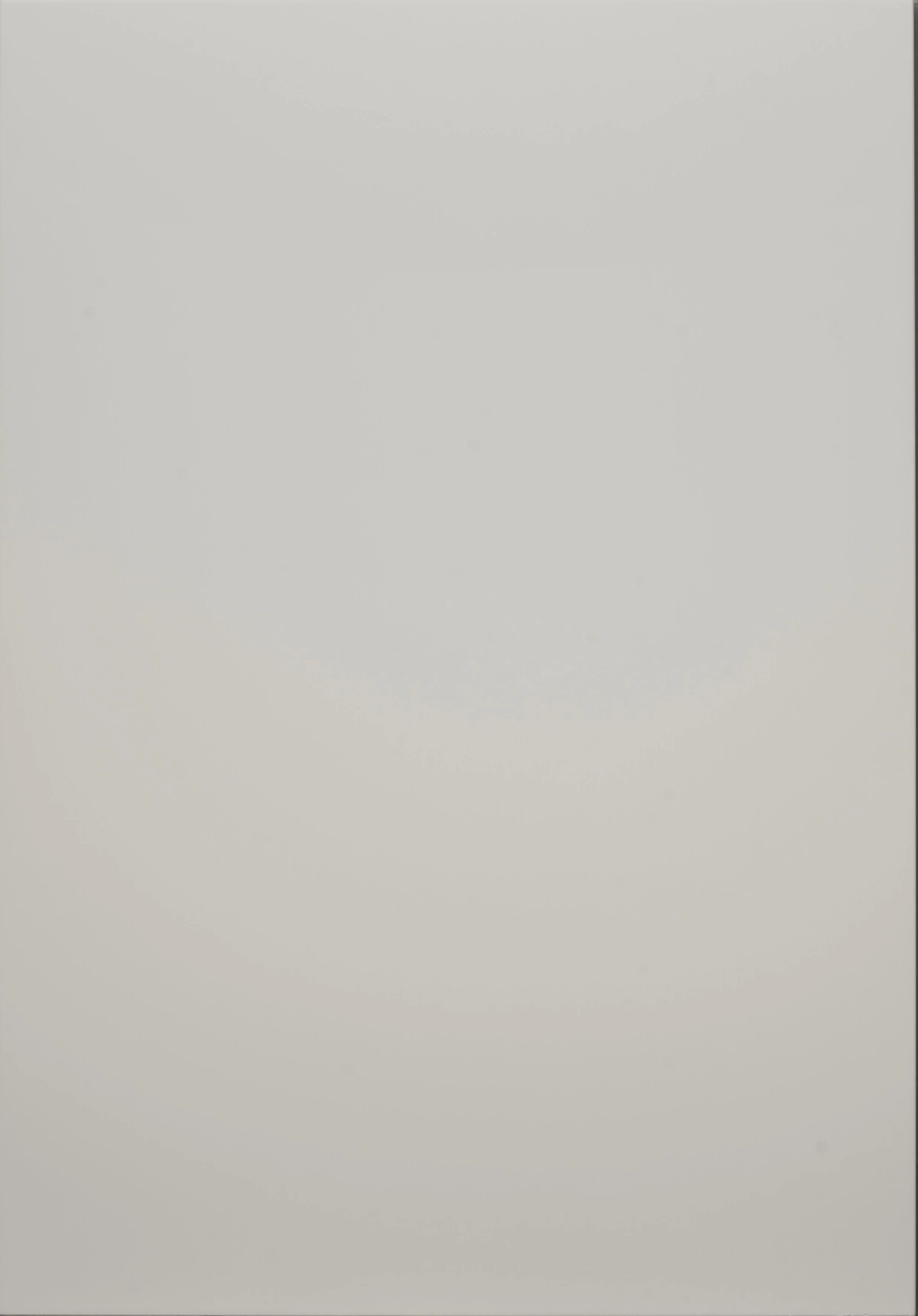 Close-up of a smooth, light gray surface with subtle shadows.