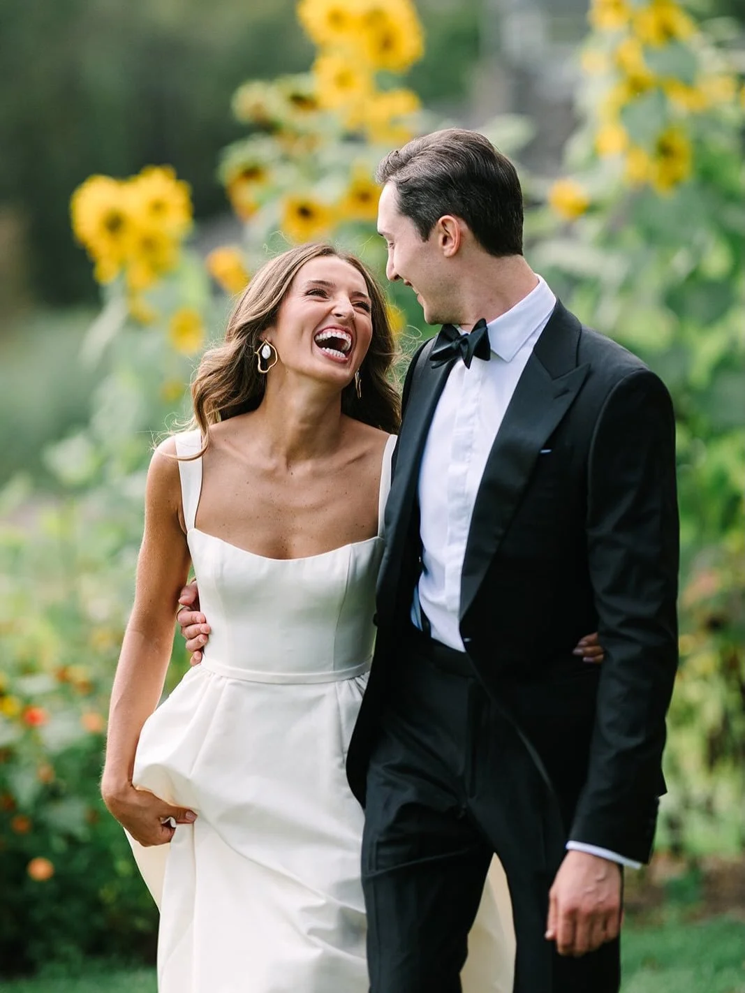 From portraits in a sunflower field at peak bloom to Ethan jumping on stage with the band, Liz &amp; Ethan&rsquo;s day was joyful and full of heart. 🌻  Cheers to these two and many more moments like this. Shoutout to @rosehill_events for the beautif