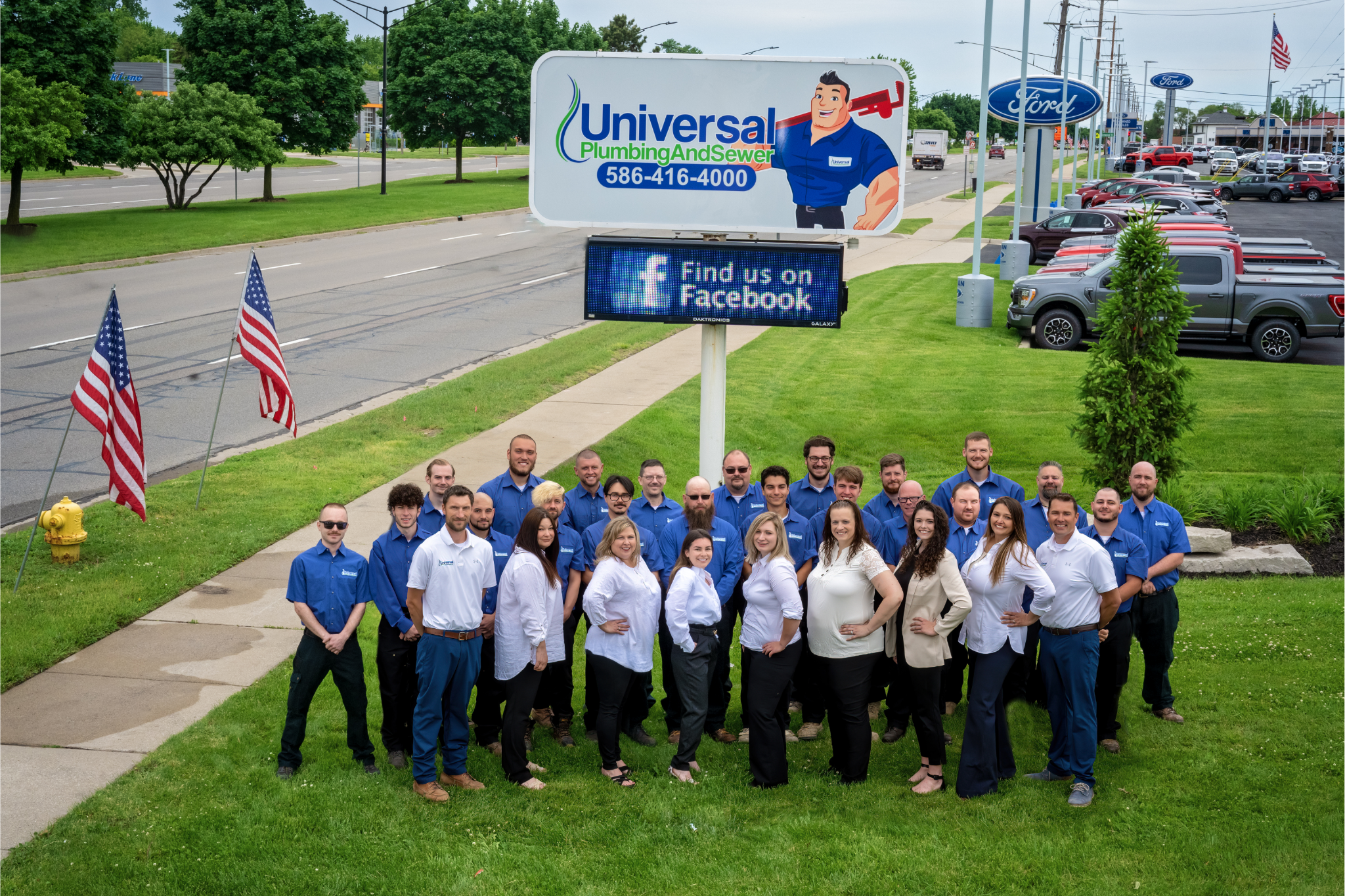 Universal Plumbing & Sewer team members gathered outside company headquarters in Metro Detroit, demonstrating the company's commitment to employee growth and customer service.