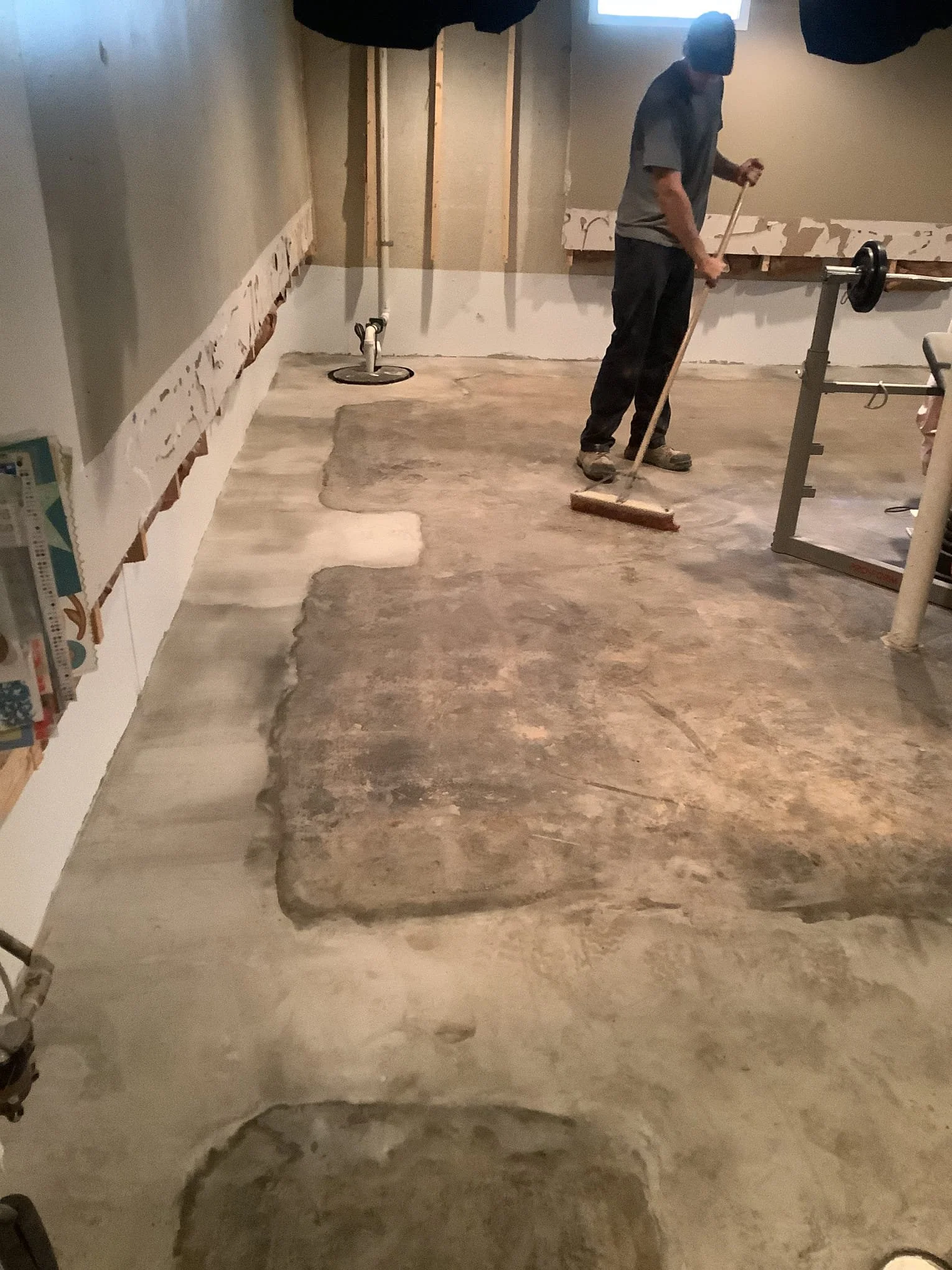 Refinished basement in Sterling Heights after waterproofing system installation and wall restoration.
