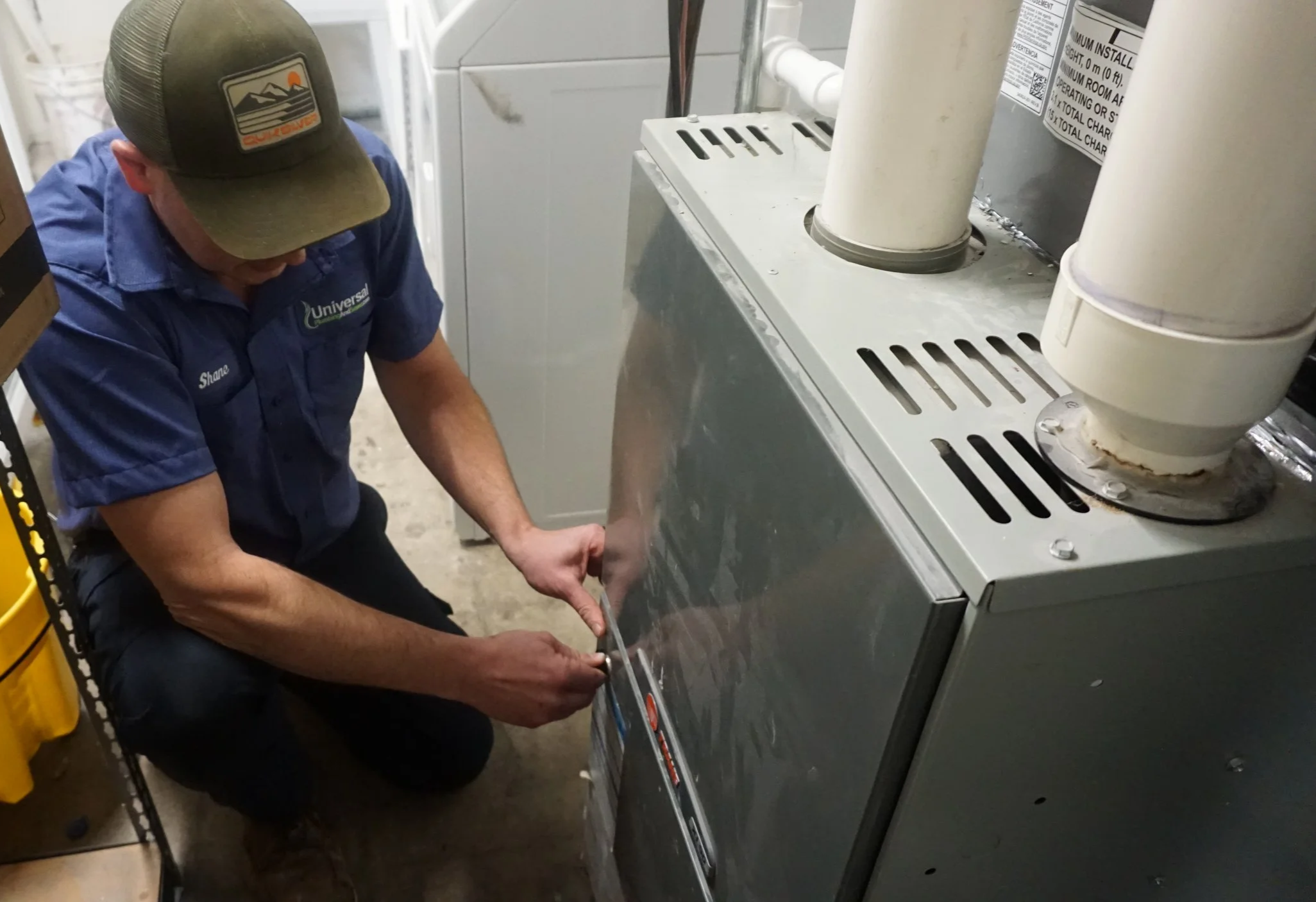 HVAC technician performing furnace repair in Oakland County Michigan