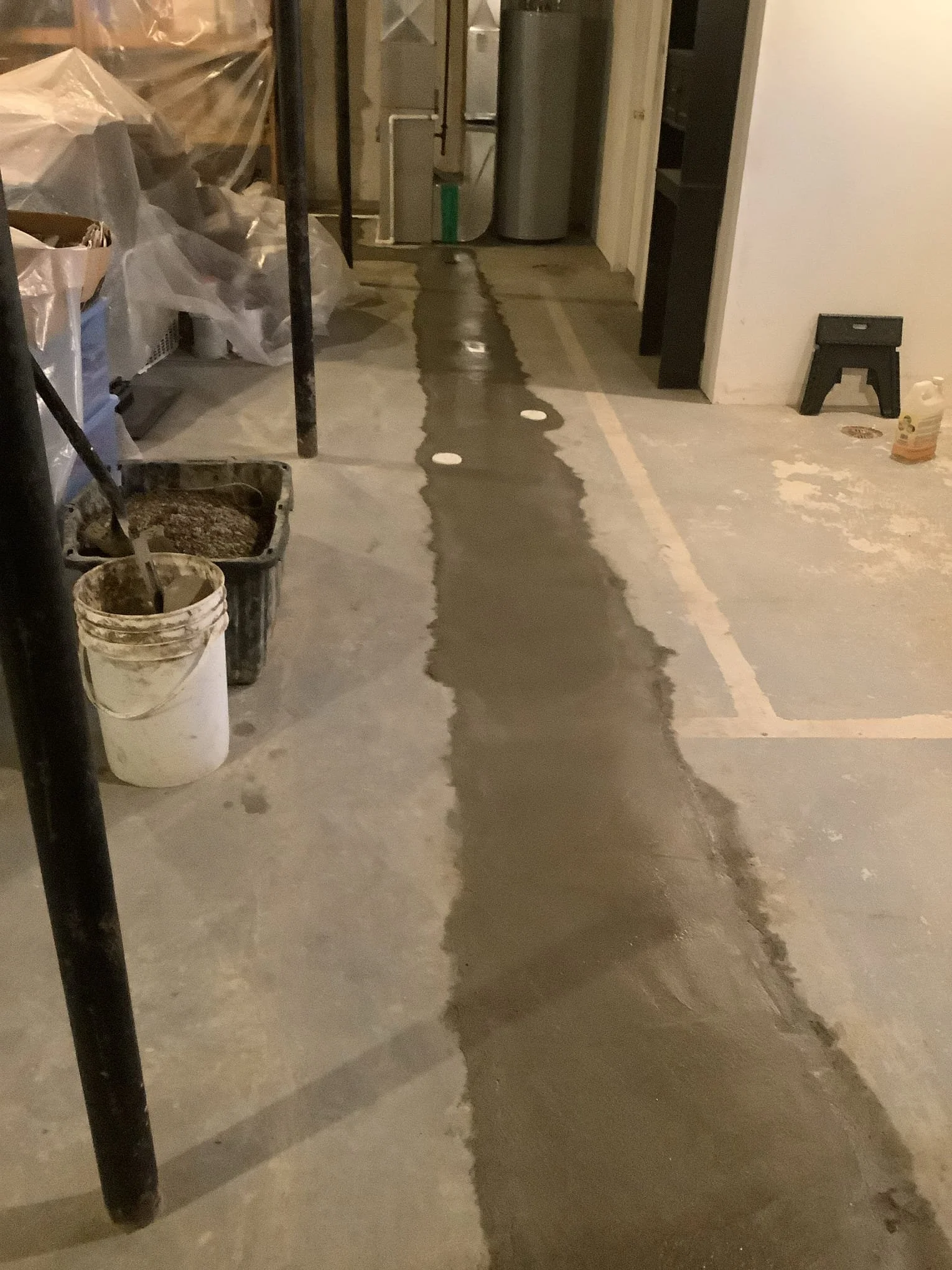 Custom basement drainage system installed in Rochester Hills to improve groundwater collection and prevent flooding.