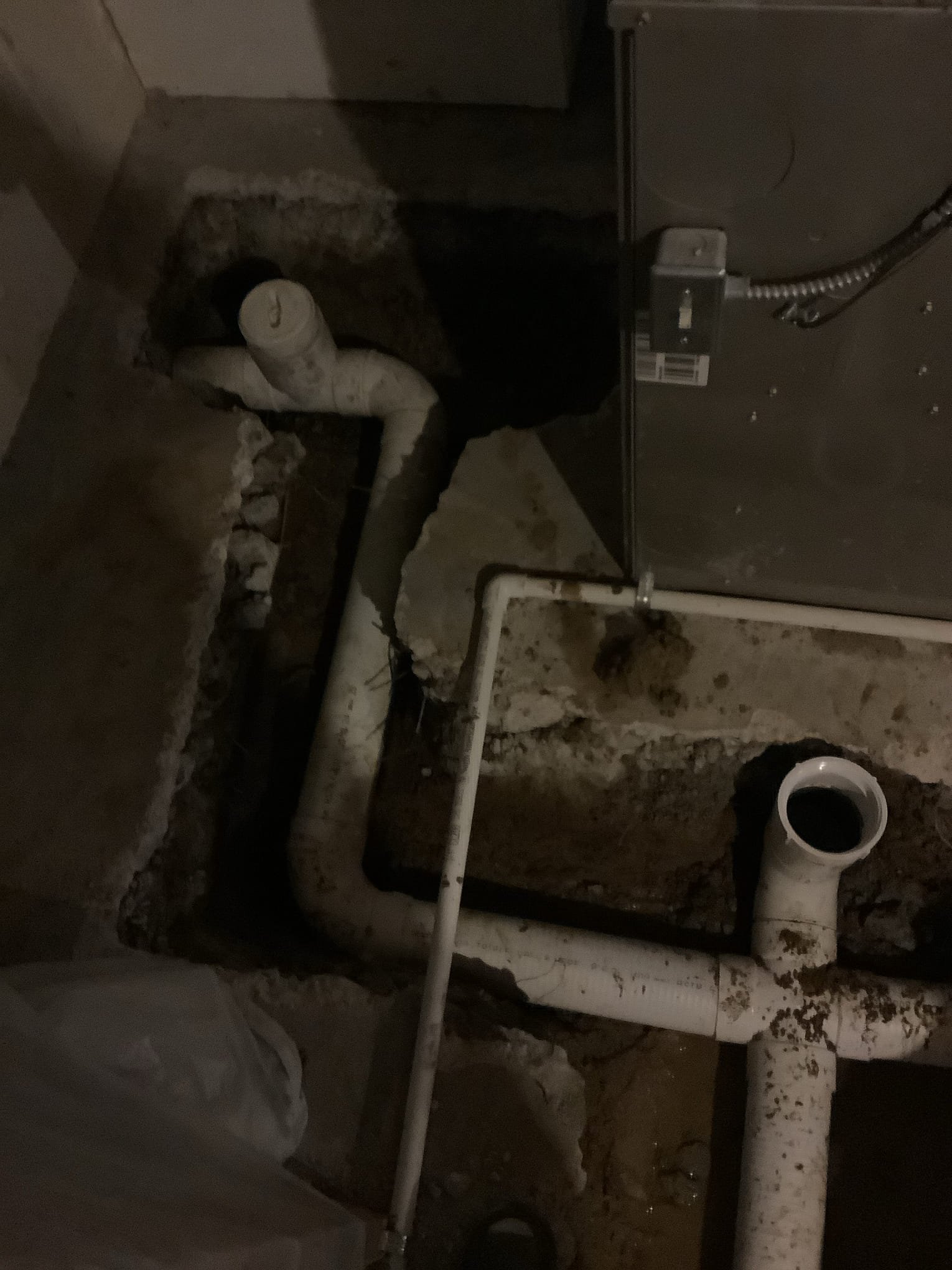 Basement in Rochester Hills experiencing water accumulation due to an ineffective non-perimeter drainage system.