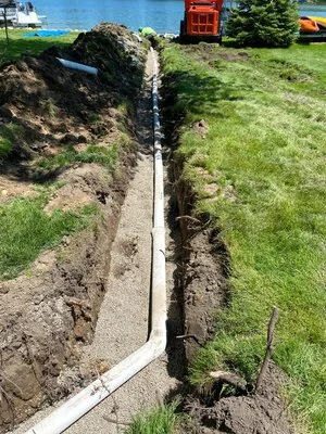 Upgraded sump pump discharge line installed by Universal Plumbing & Sewer for improved drainage performance.