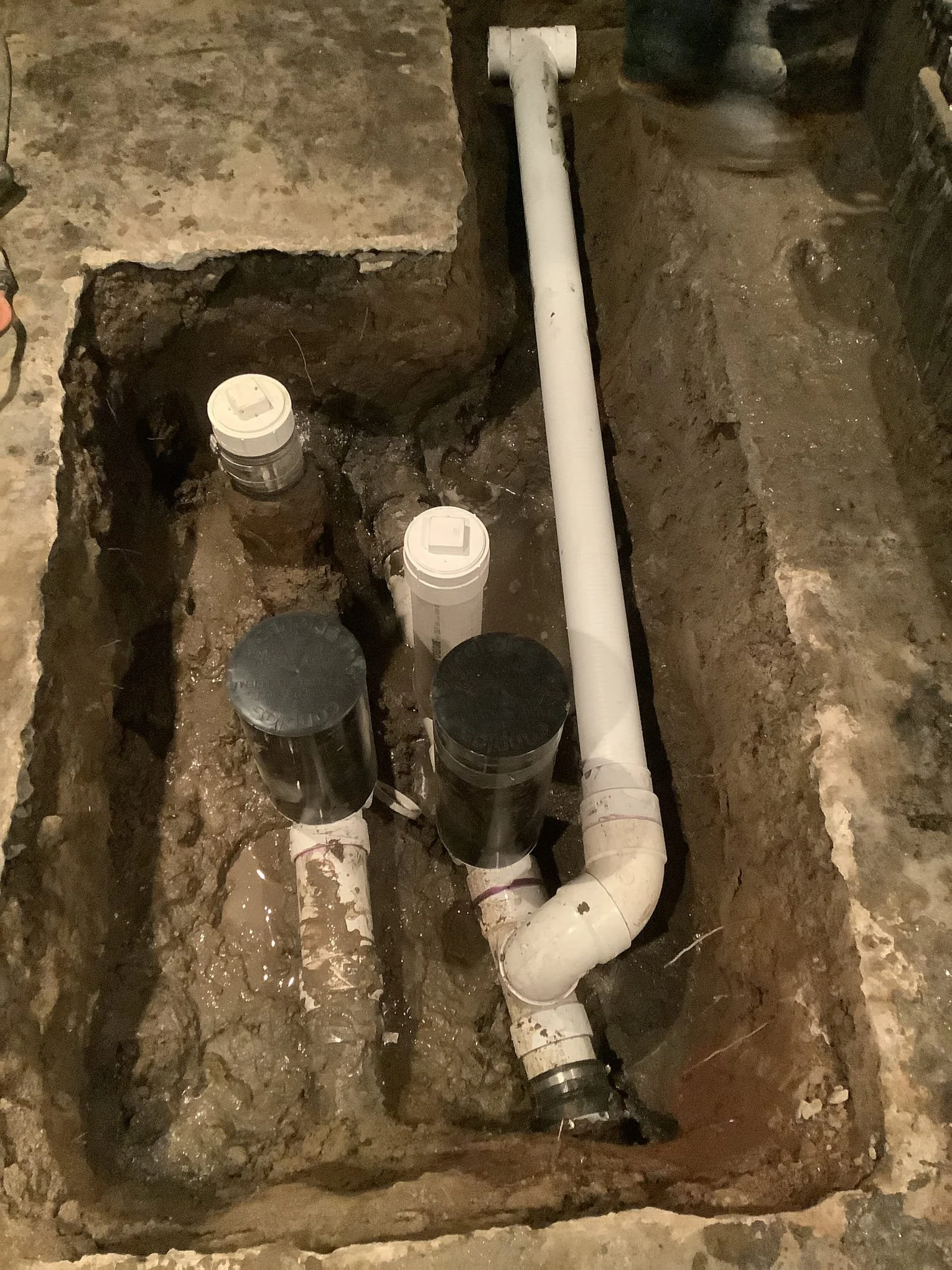Refinished basement in Sterling Heights after waterproofing system installation and wall restoration.