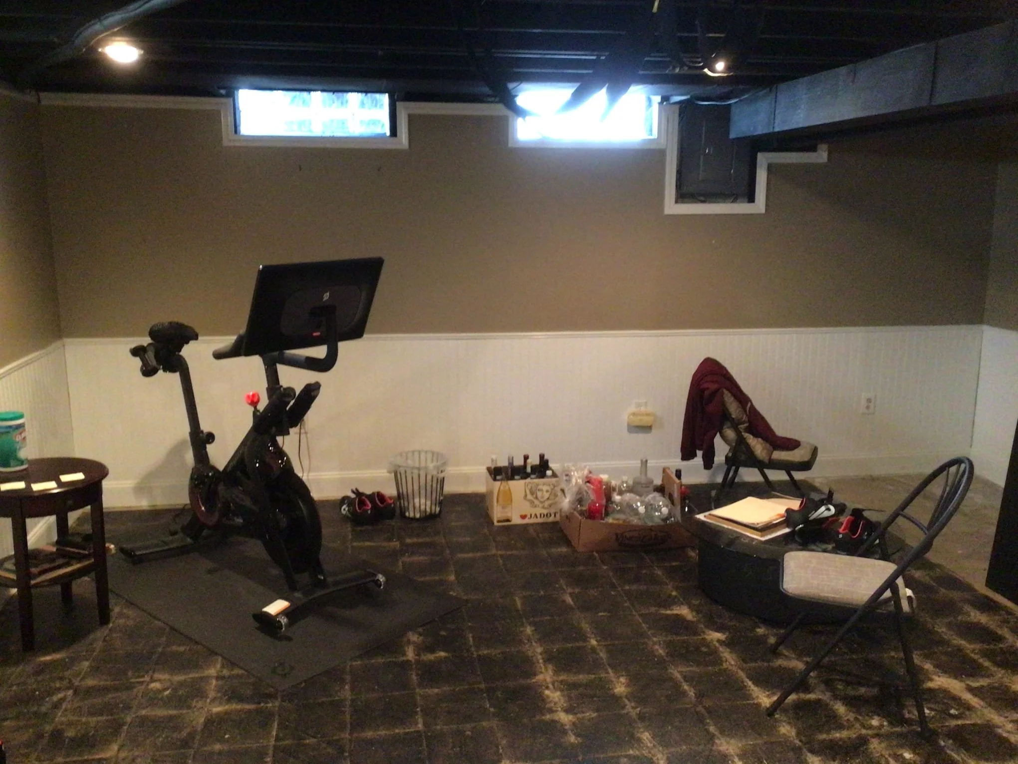 Finished basement in Sterling Heights showing water damage behind walls before waterproofing repairs.