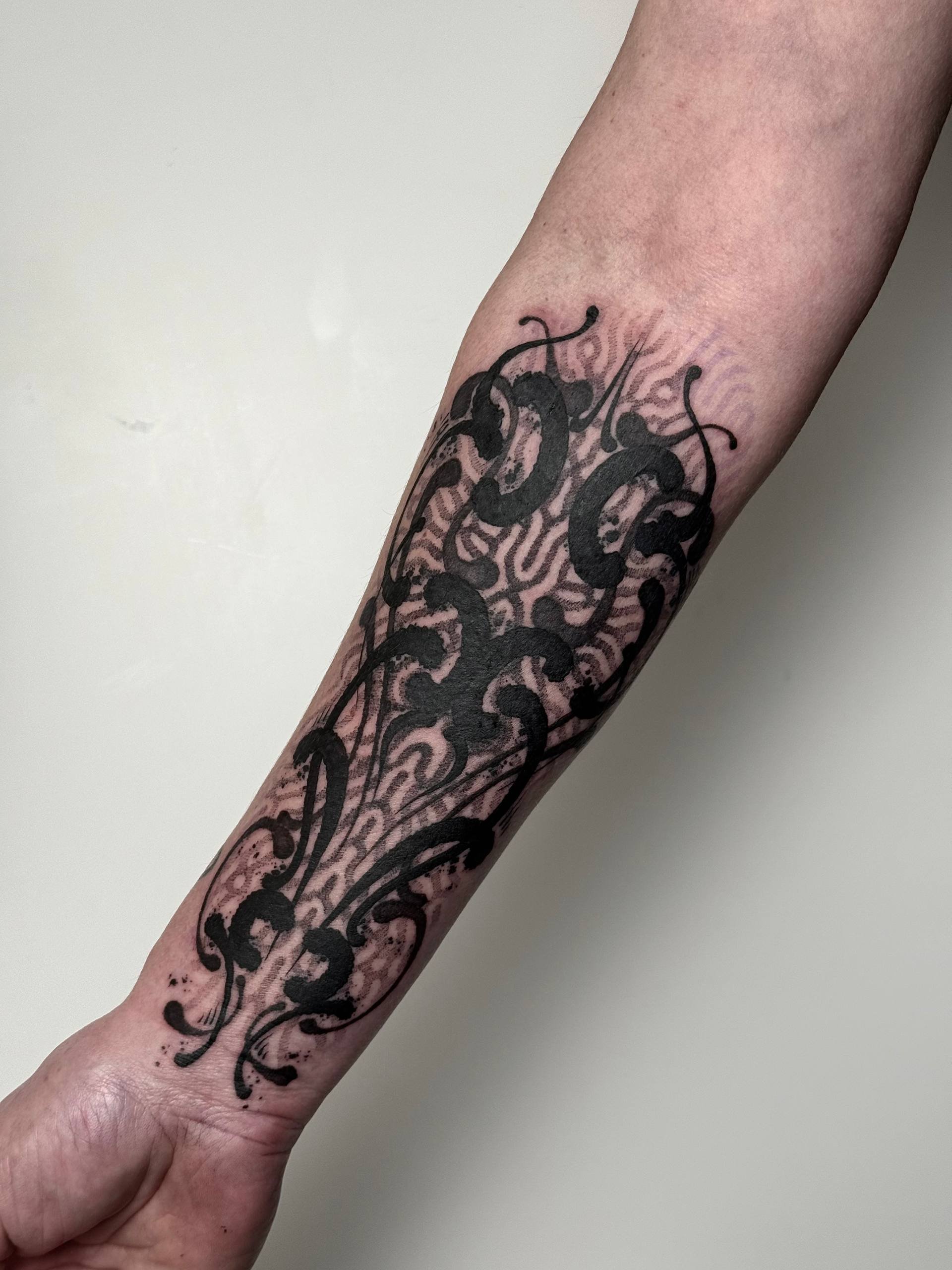 Forearm polymorph tattoo