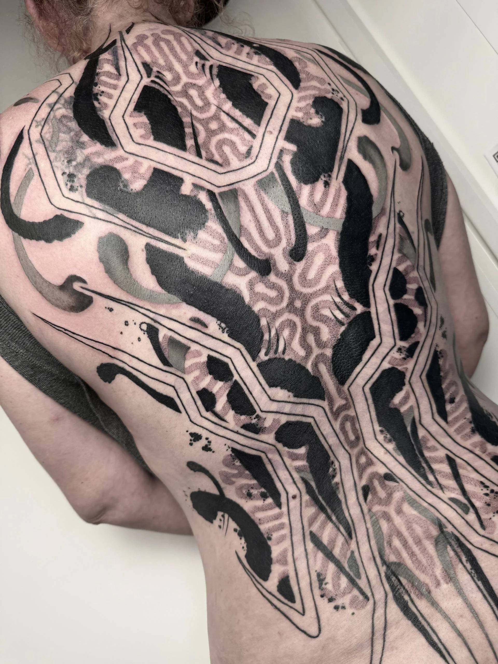 Full back polymorph tattoo by Birmingham tattoo artist Harrison Brewer.