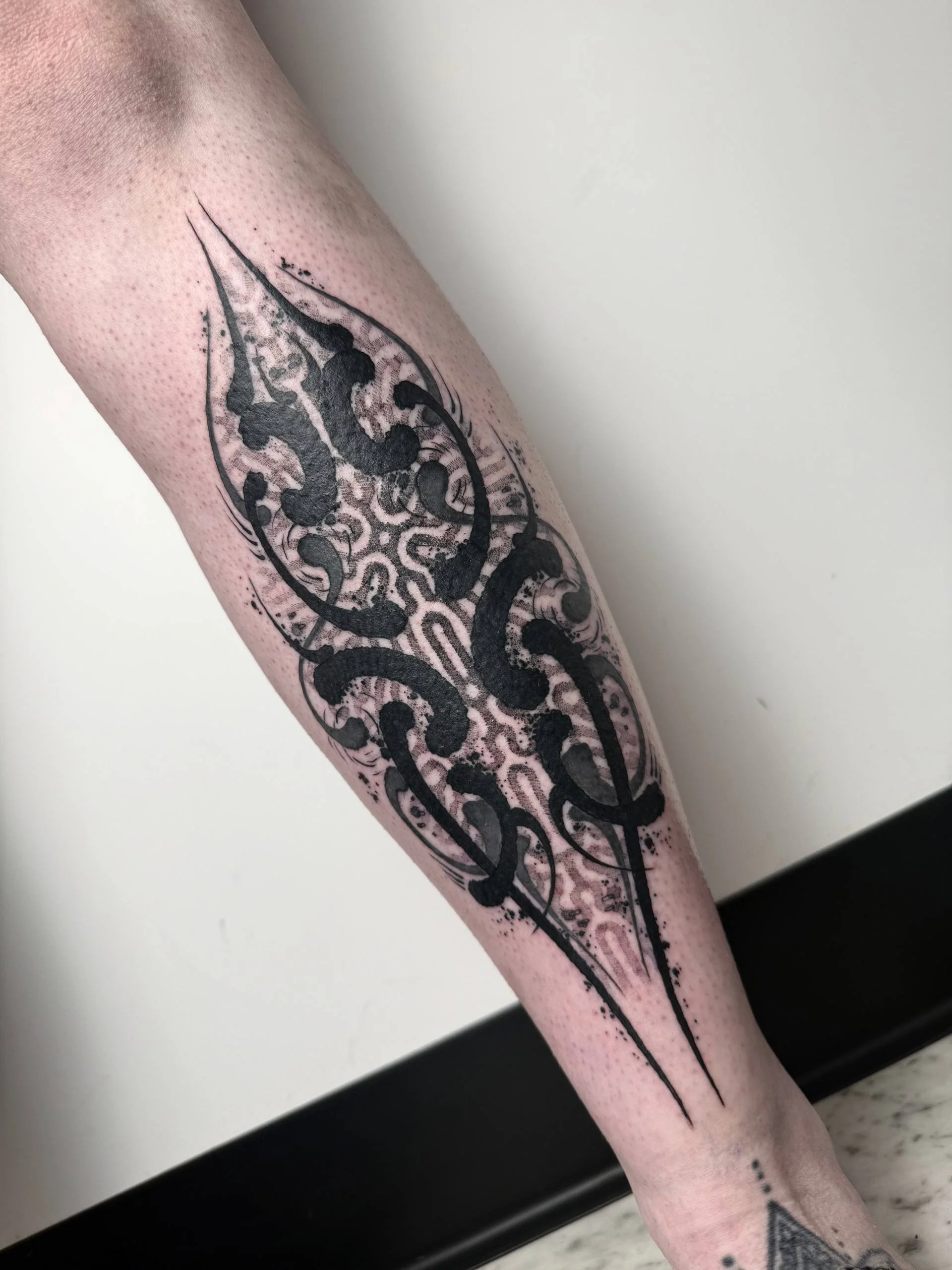 Polymorph shin tattoo