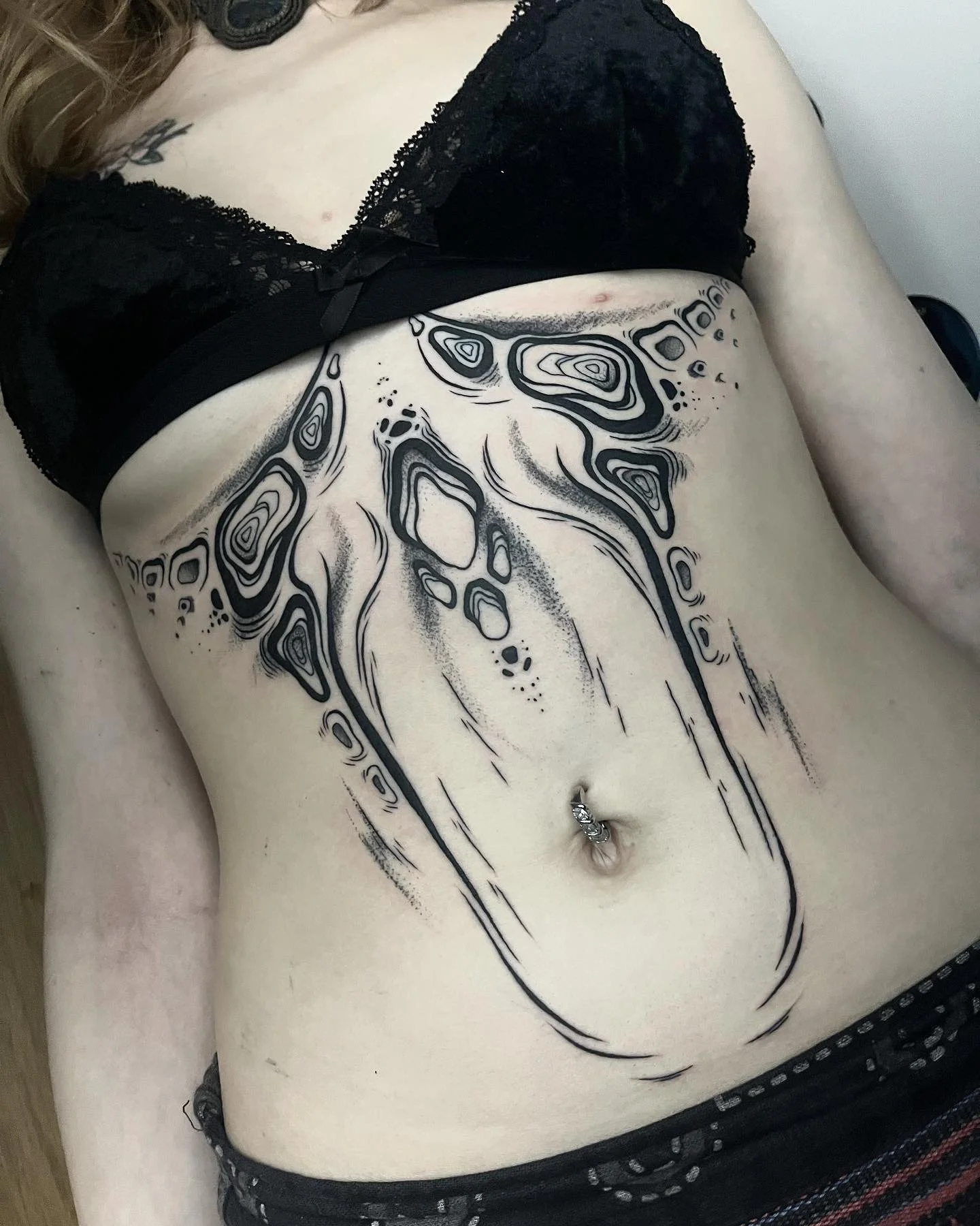 abstract-sternum-underbust-tattoo.jpg