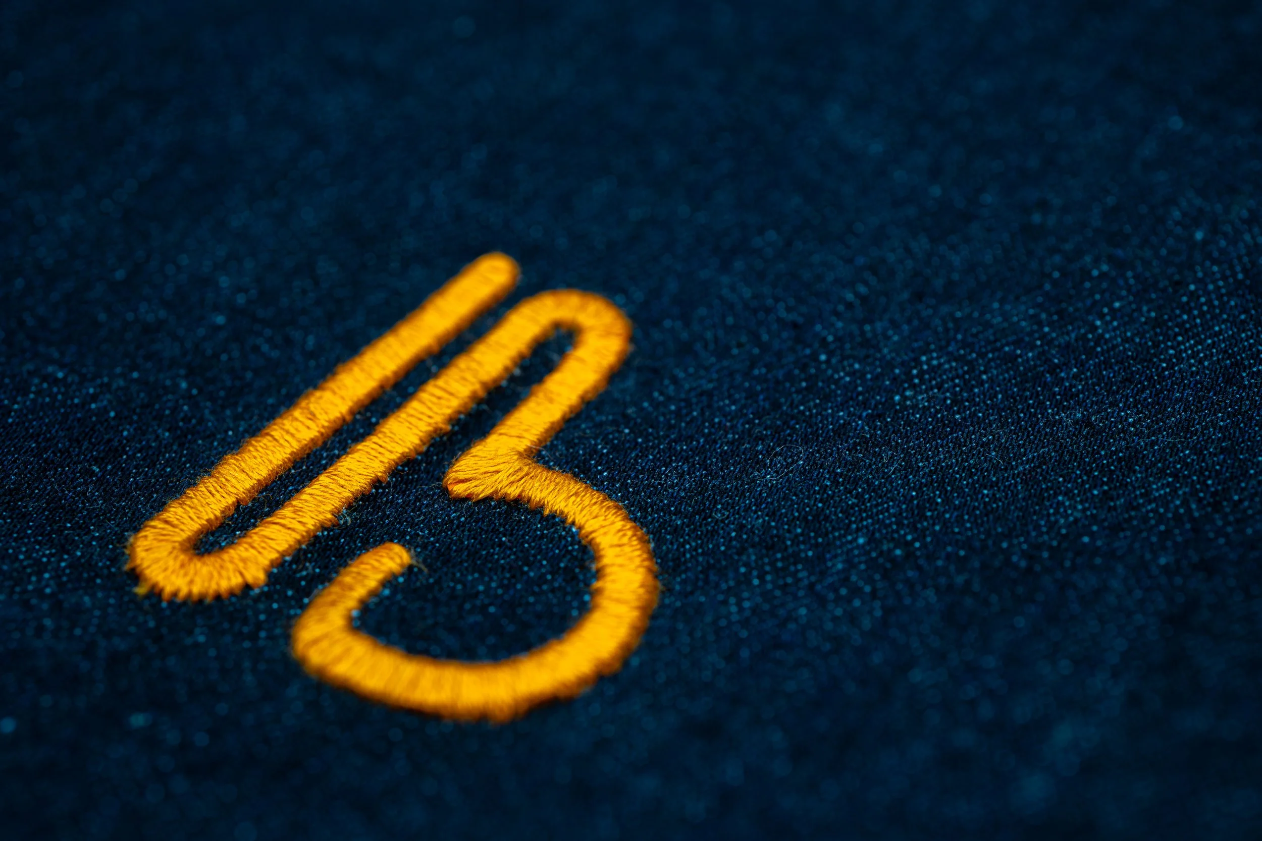 orange embroidered B