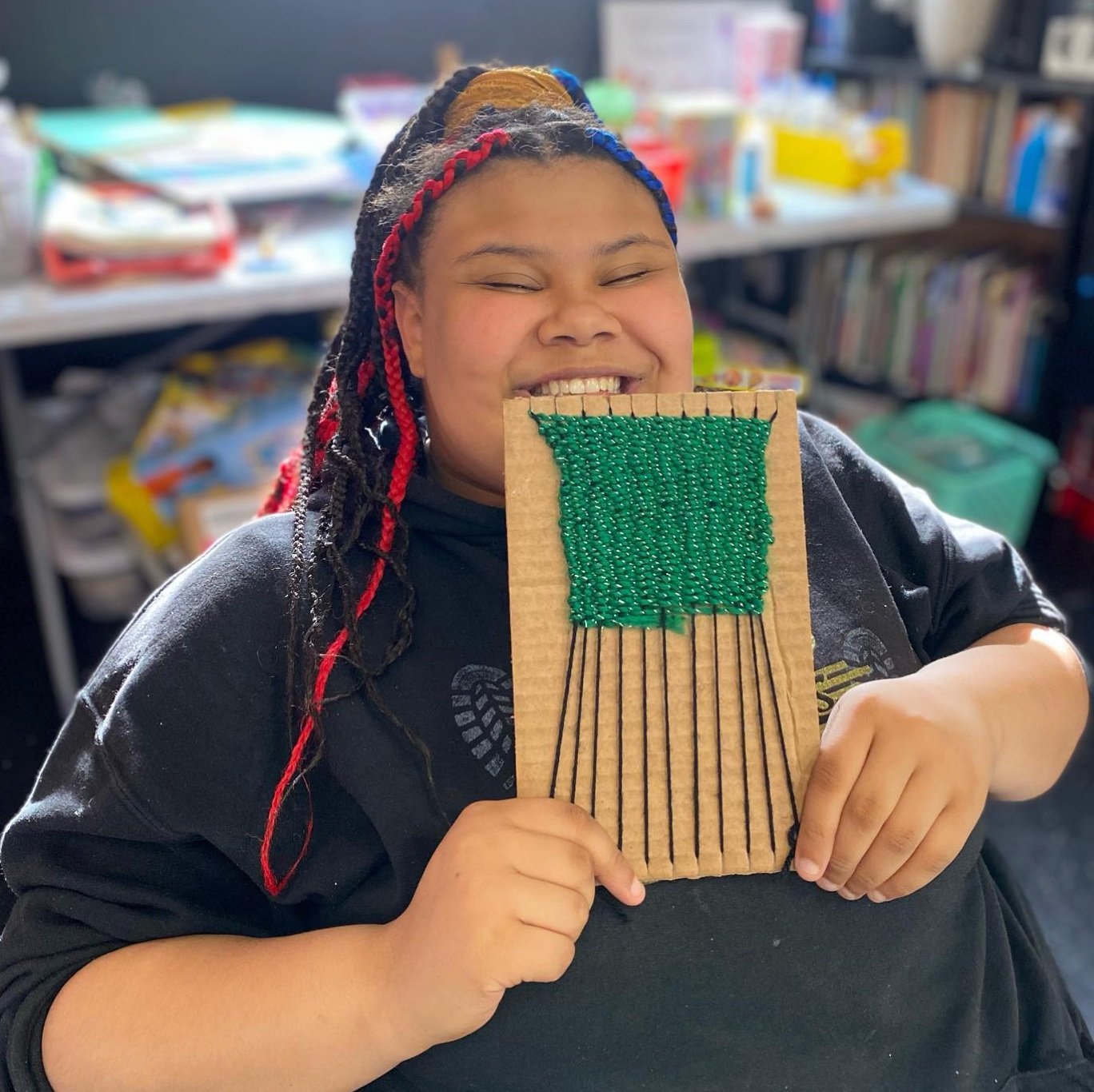 Program participant showcasing craft project