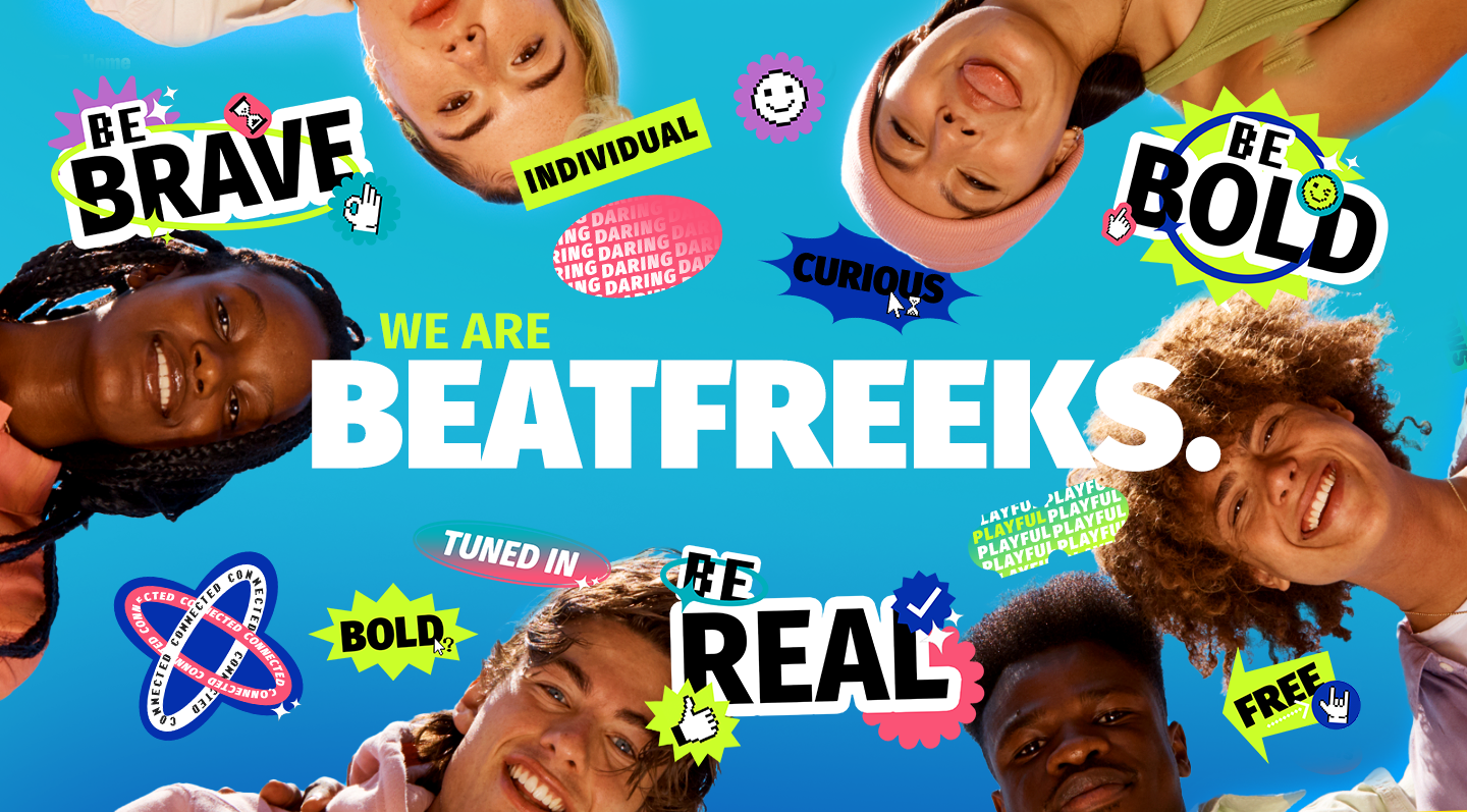 Group of diverse smiling young people looking down at camera image with colorful words and icons like 'Be Brave', 'Be Bold', 'We Are Beatreeks', 'Curious', 'Bold', 'De Real', and 'Free' on a blue background.