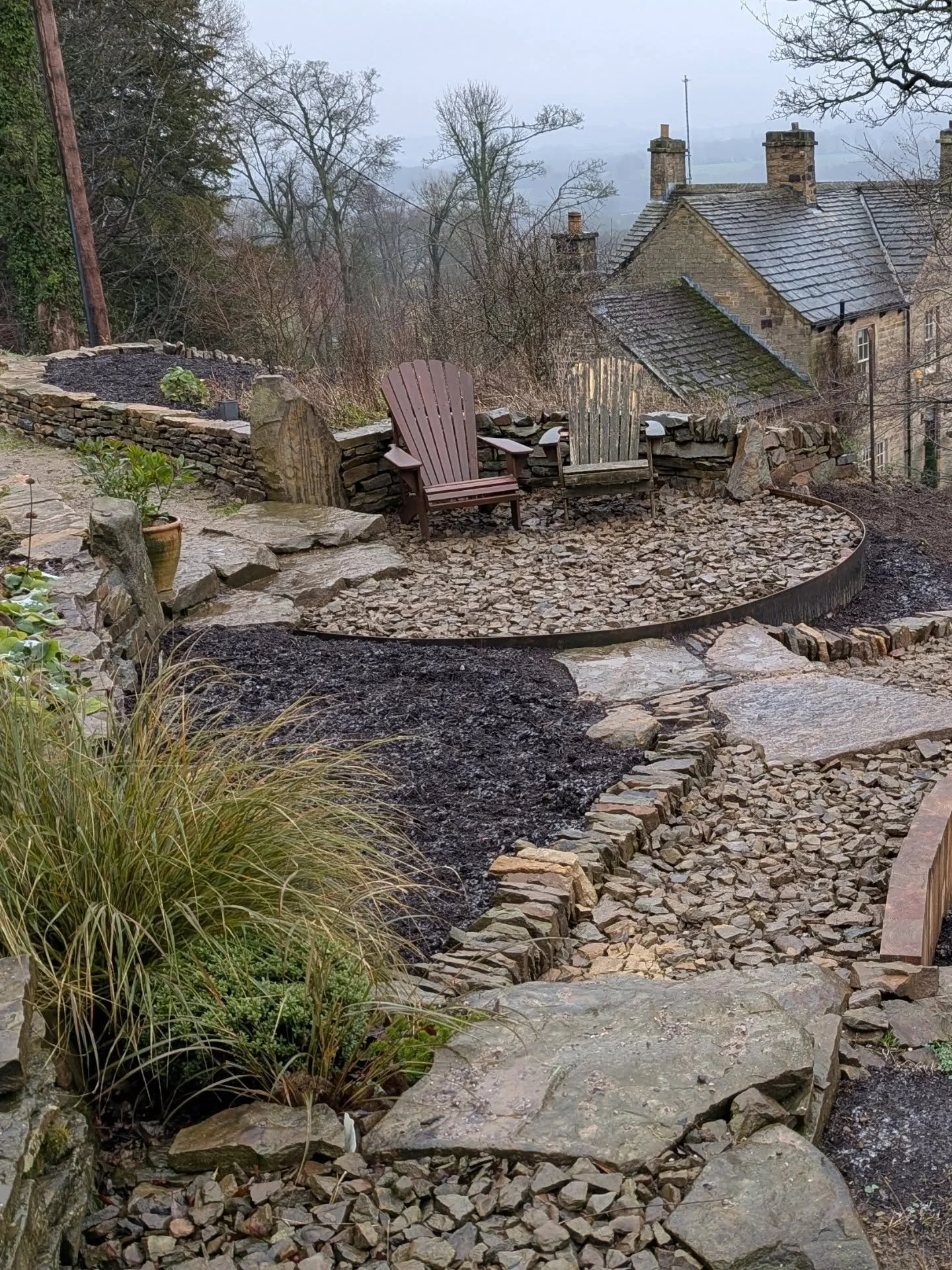 Miserable weather for the last day building this project with a few photos from the 2 nice days since we've been there... This job was all about making use of a big pile of stone on site. Big stones were used as steps and walling, smaller stones in g