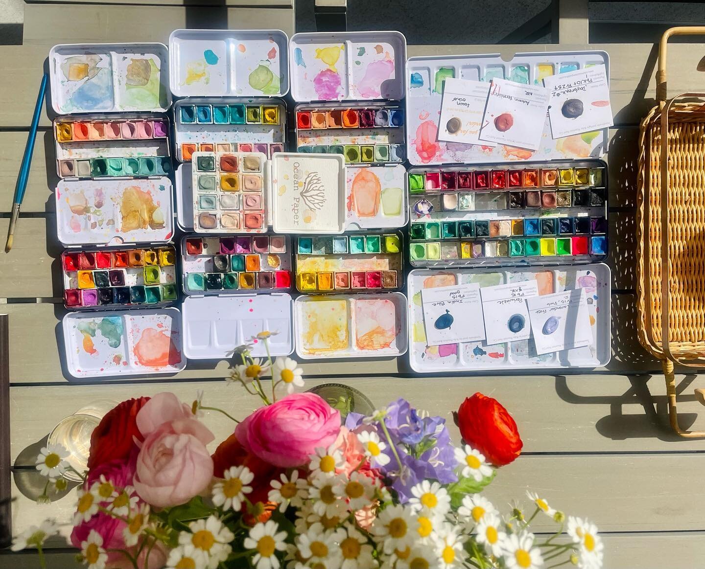 I got out ALL my watercolor paints today so that I could create a new pallet based on this floral arrangement. I was loving the pinks + bright oranges, mixed with yellow + lavender. I just had to have a paint set that mimicked these colors.
