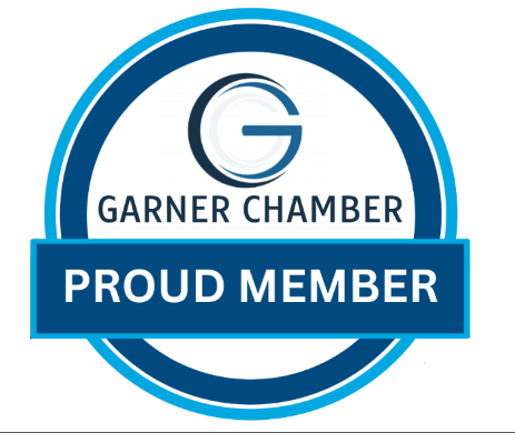 Logo of Garner Chamber featuring a large letter G, with the words 'Garner Chamber' and a blue banner with 'Proud Member' inside a circular blue and white design.
