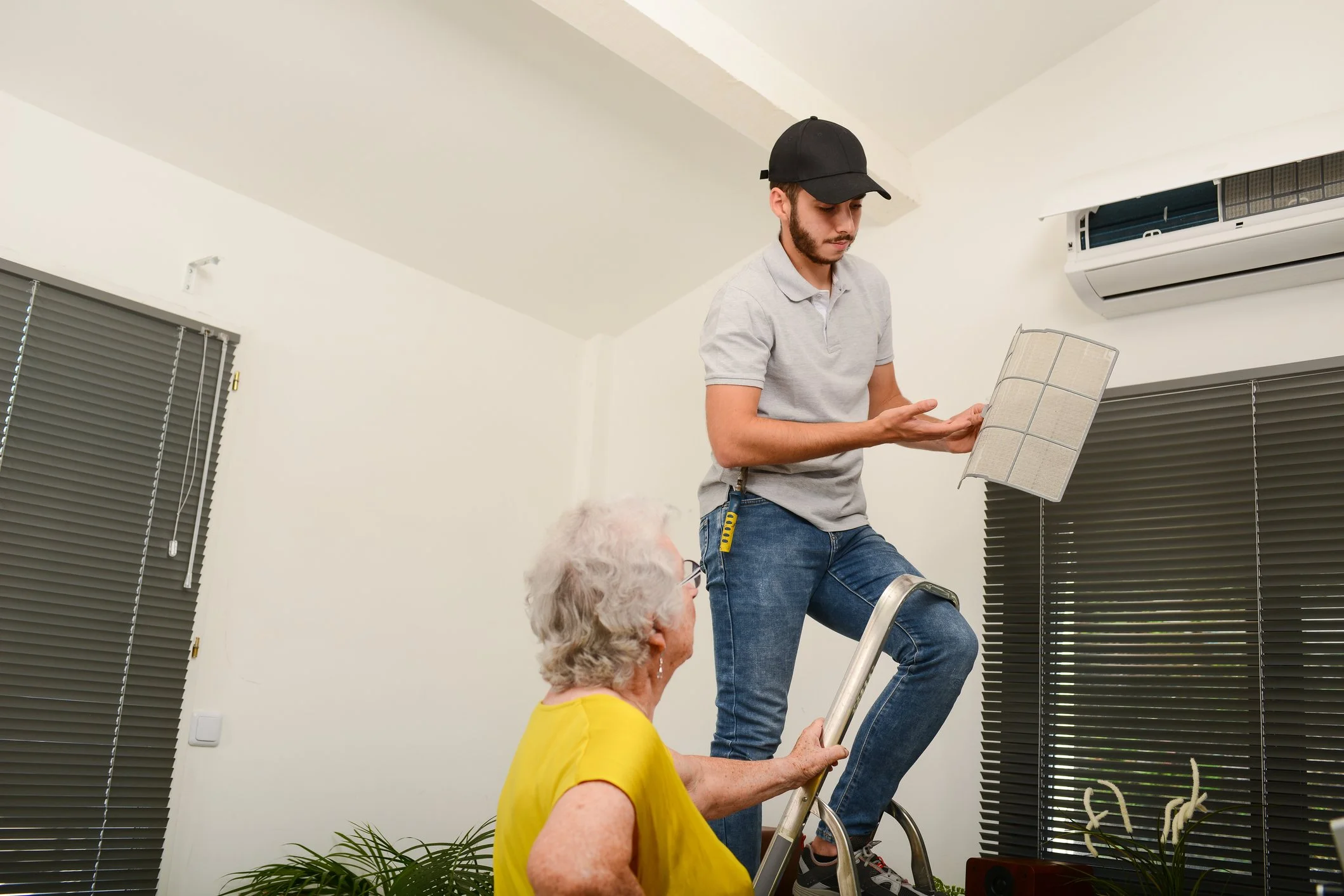 3rd-generation technician John Bodnar performing a complex diagnostic on a furnace, representing the "Repair-First" expertise offered at Bodnar HVAC.