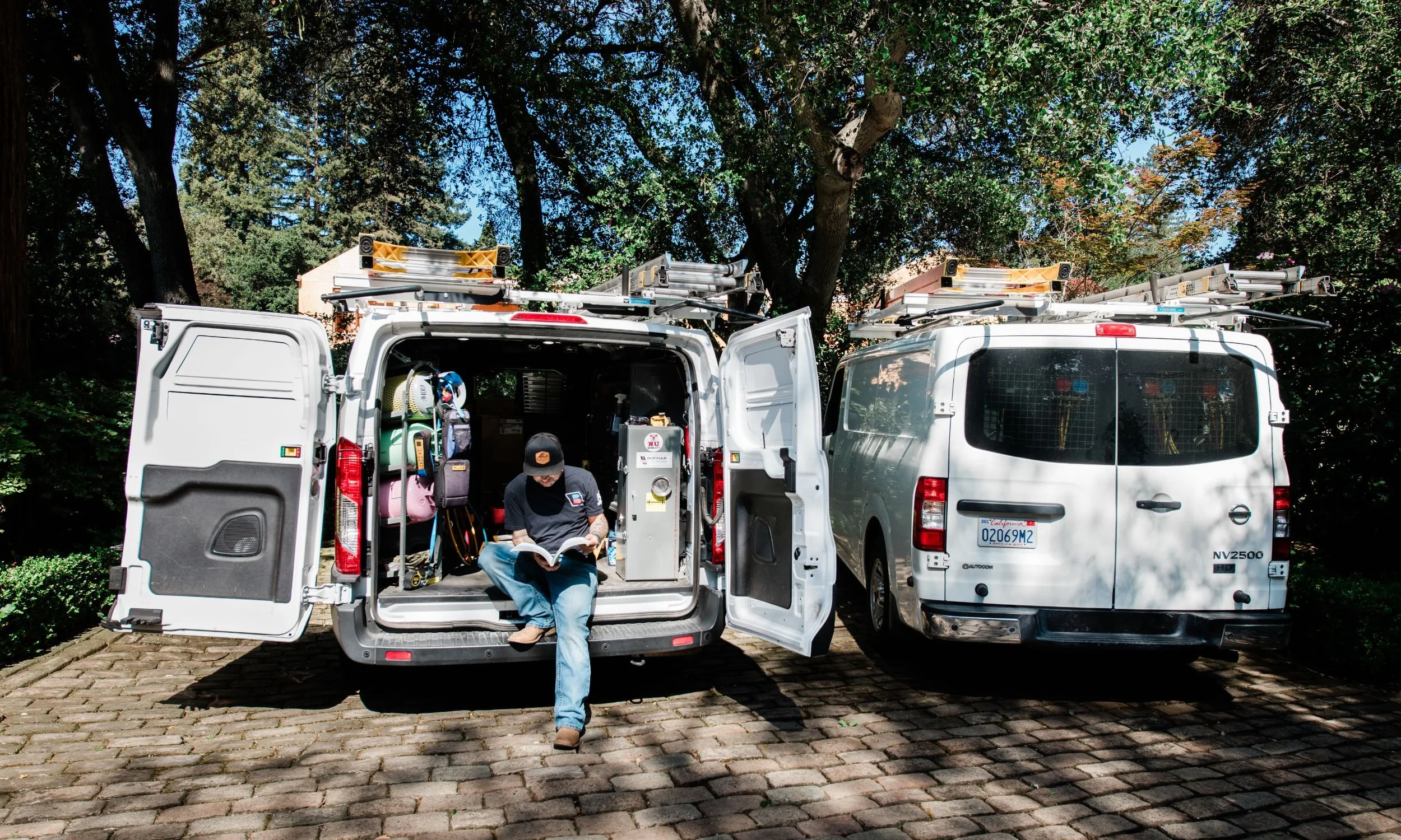 Bodnar HVAC service vans parked on a residential driveway in Atherton, California, highlighting our deep local roots and commitment to providing expert heating and cooling services throughout the Peninsula.
