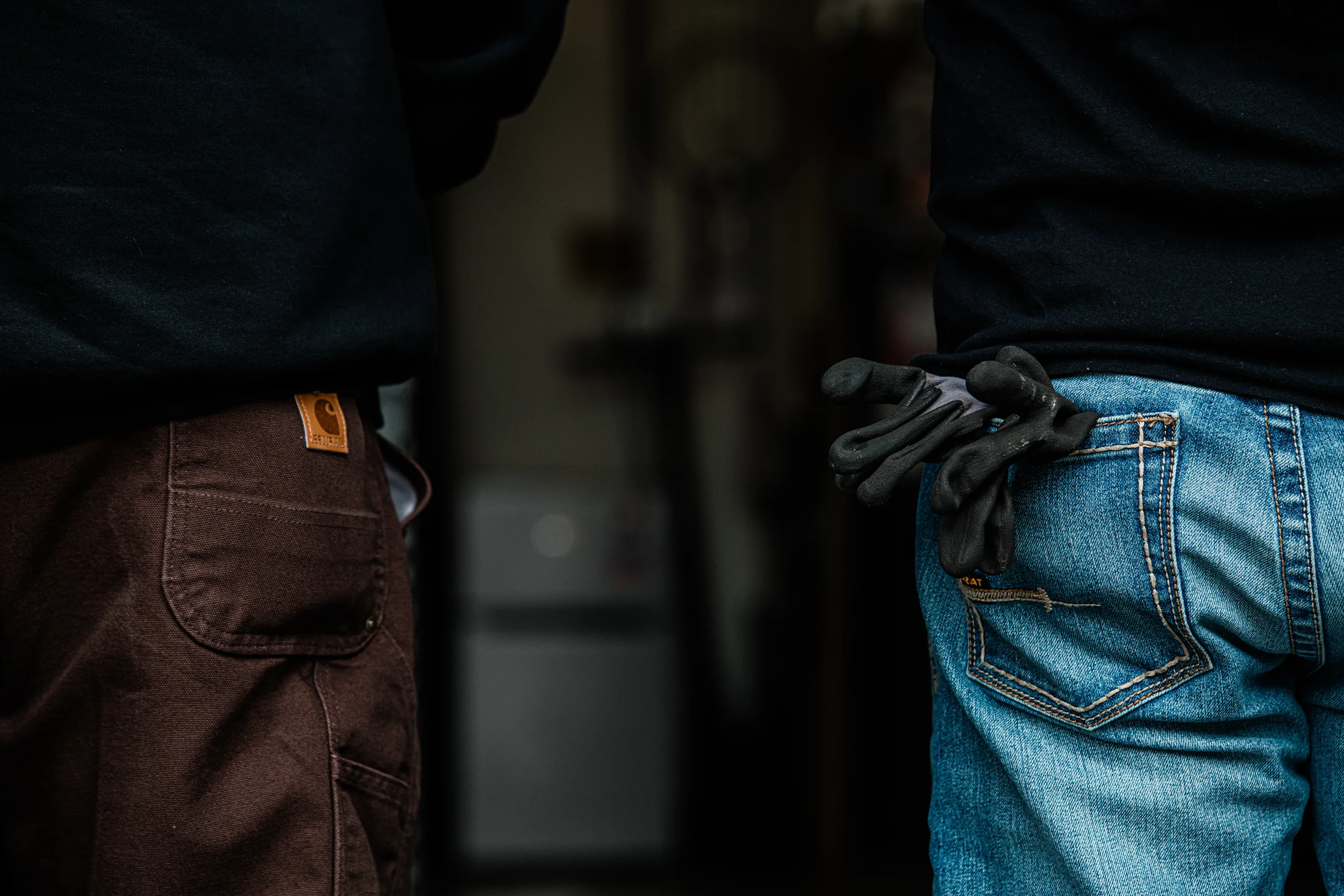 Close-up of two professional HVAC technicians in work gear, highlighting the hands-on, expert nature of Bodnar HVAC's residential service.