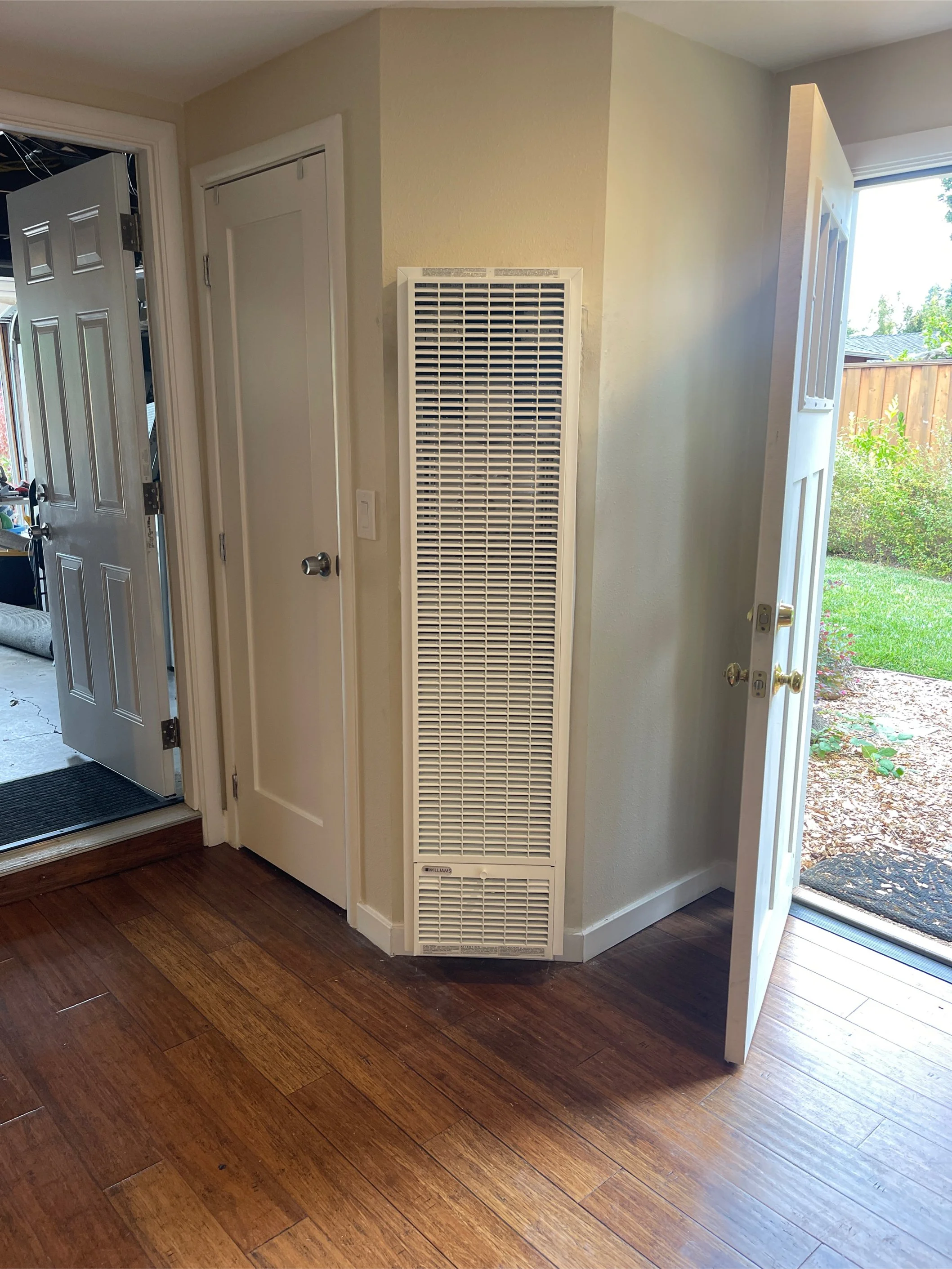Professional installation of a Williams gas wall heater in a compact ADU (Accessory Dwelling Unit) in Redwood City, CA, showing a clean, space-saving heating solution.