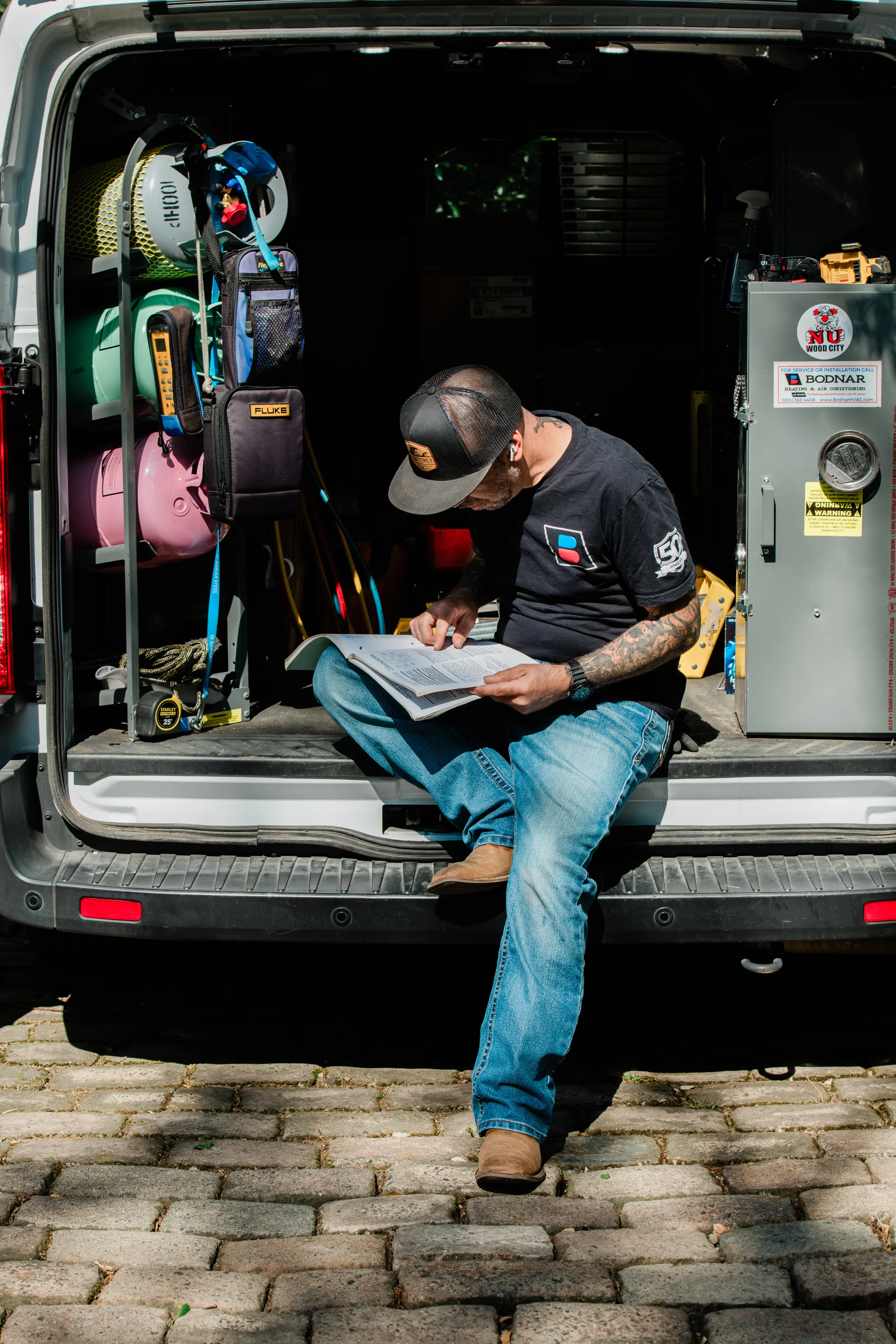 John Bodnar conducting a deep-dive engineering analysis and reviewing technical specifications during a paid HVAC consultation in Redwood City.