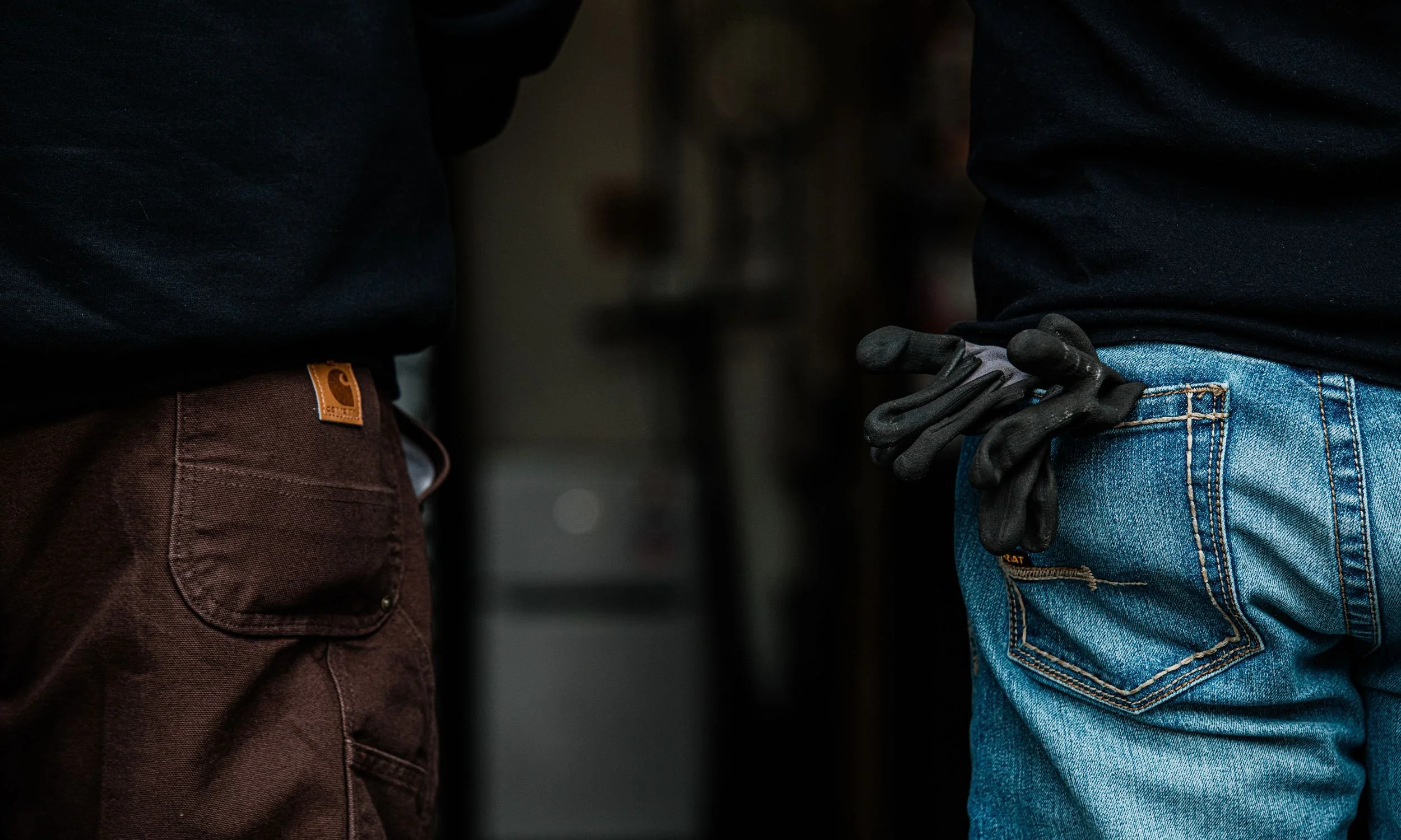 Close-up of two professional HVAC technicians in work gear, highlighting the hands-on, expert nature of Bodnar HVAC's residential service.