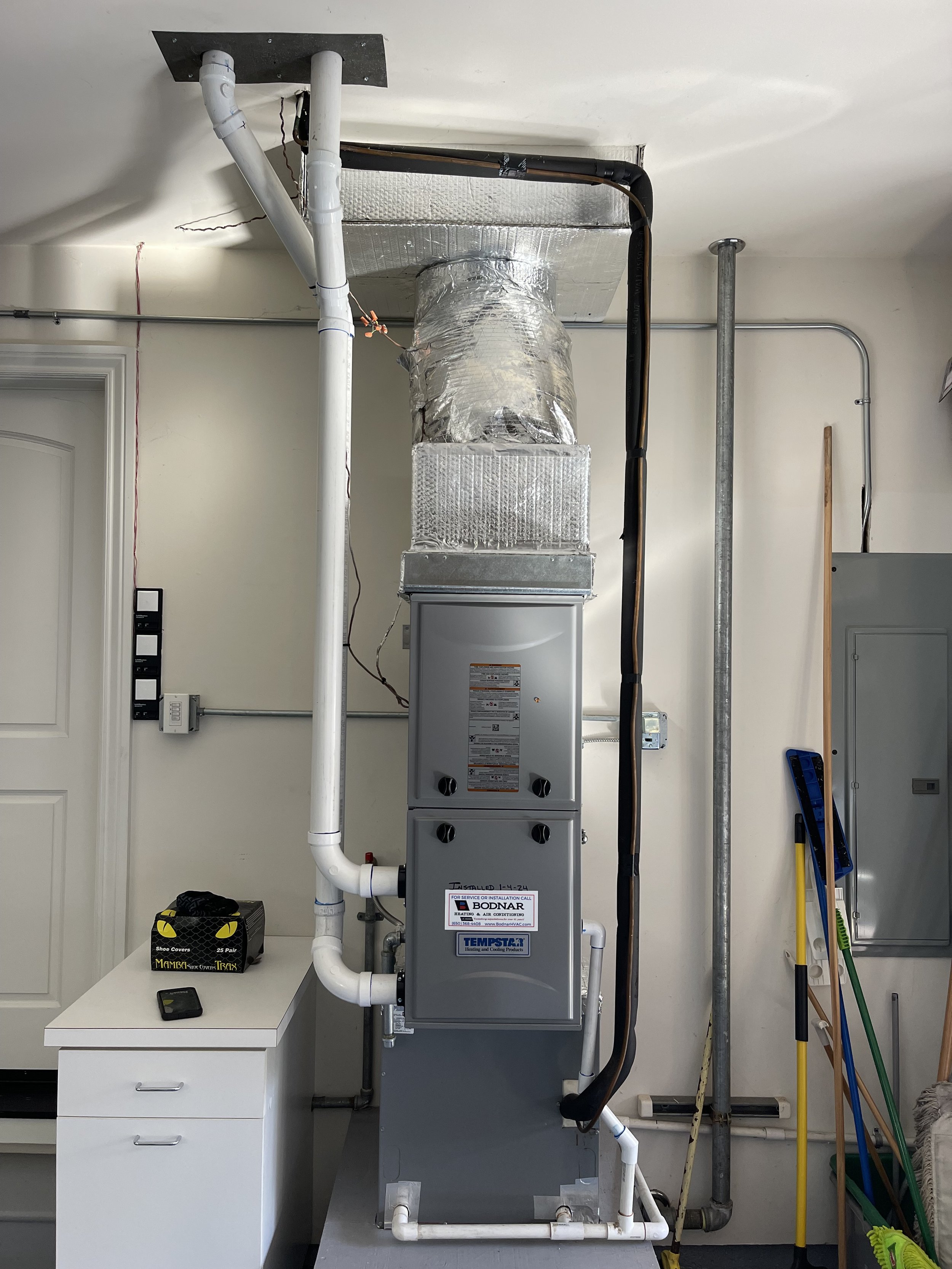 New Tempstar gas furnace and A/C system with clean PVC venting and insulated lineset in Redwood Shores.