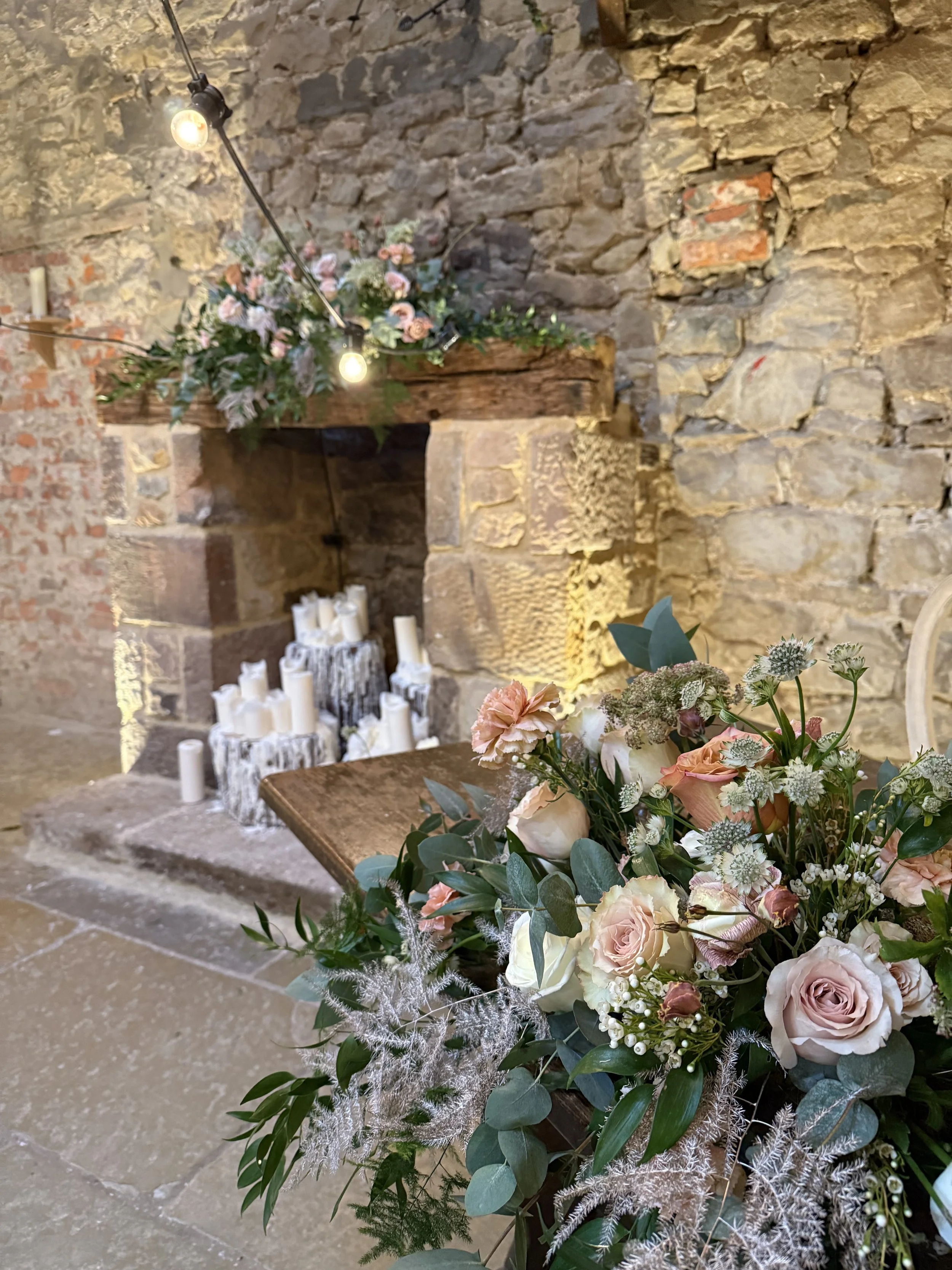 Flower clouds and mantle flowers - all repurposed to the wedding breakfast