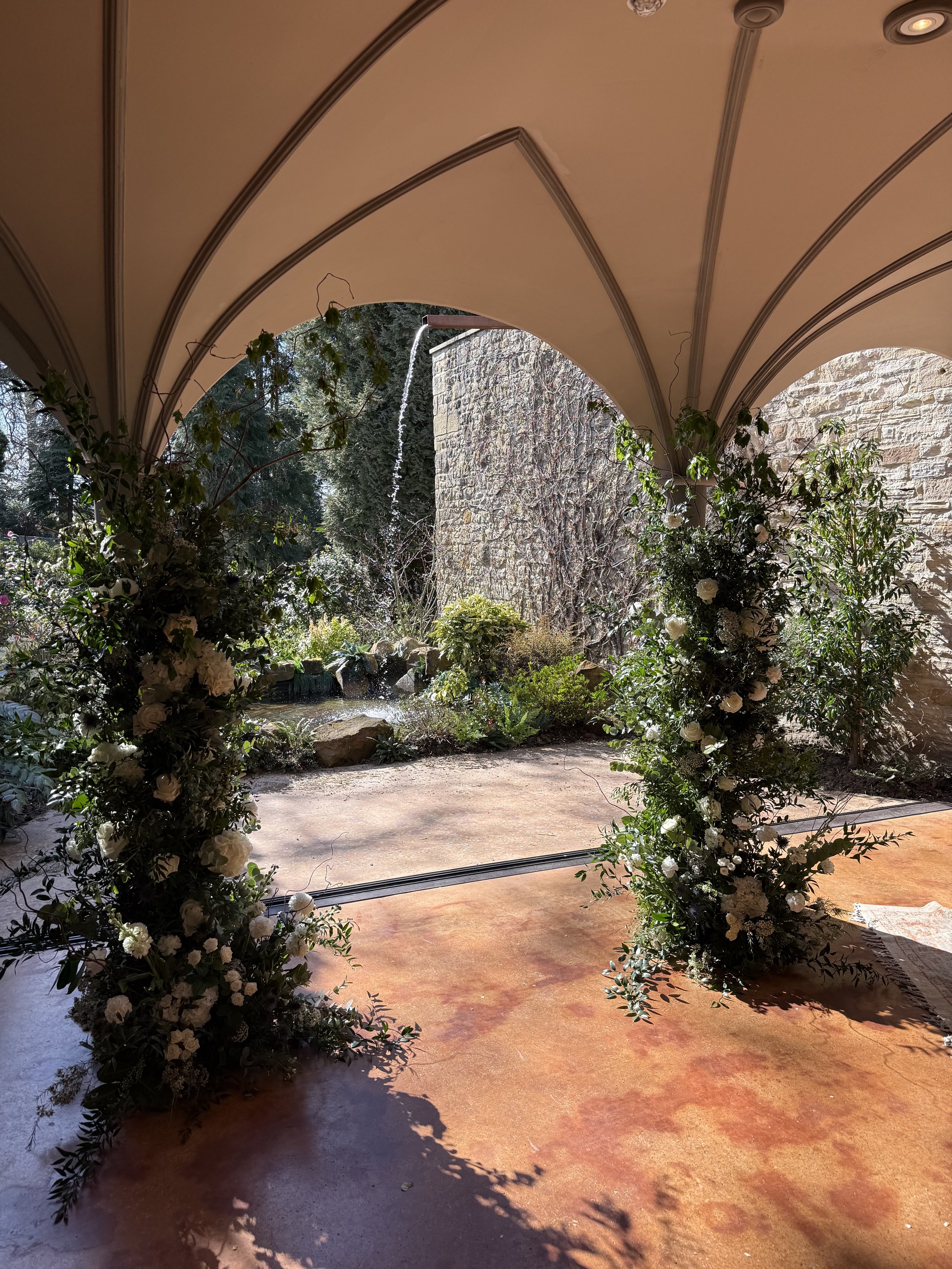 Another view of the floral columns looking out to the stunning water feature and gardens