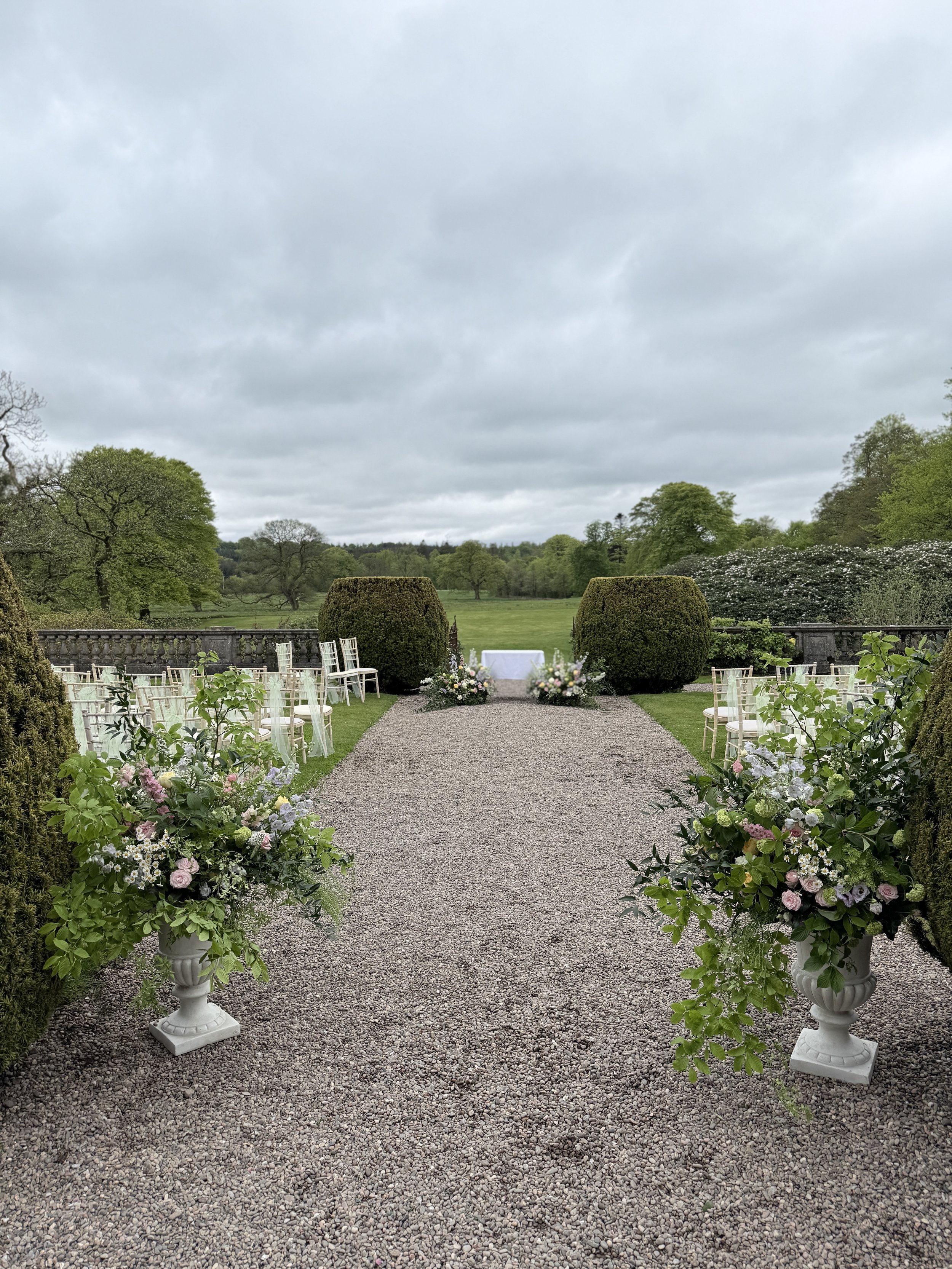 Outdoor ceremony floral designs, all created with repurposing in mind