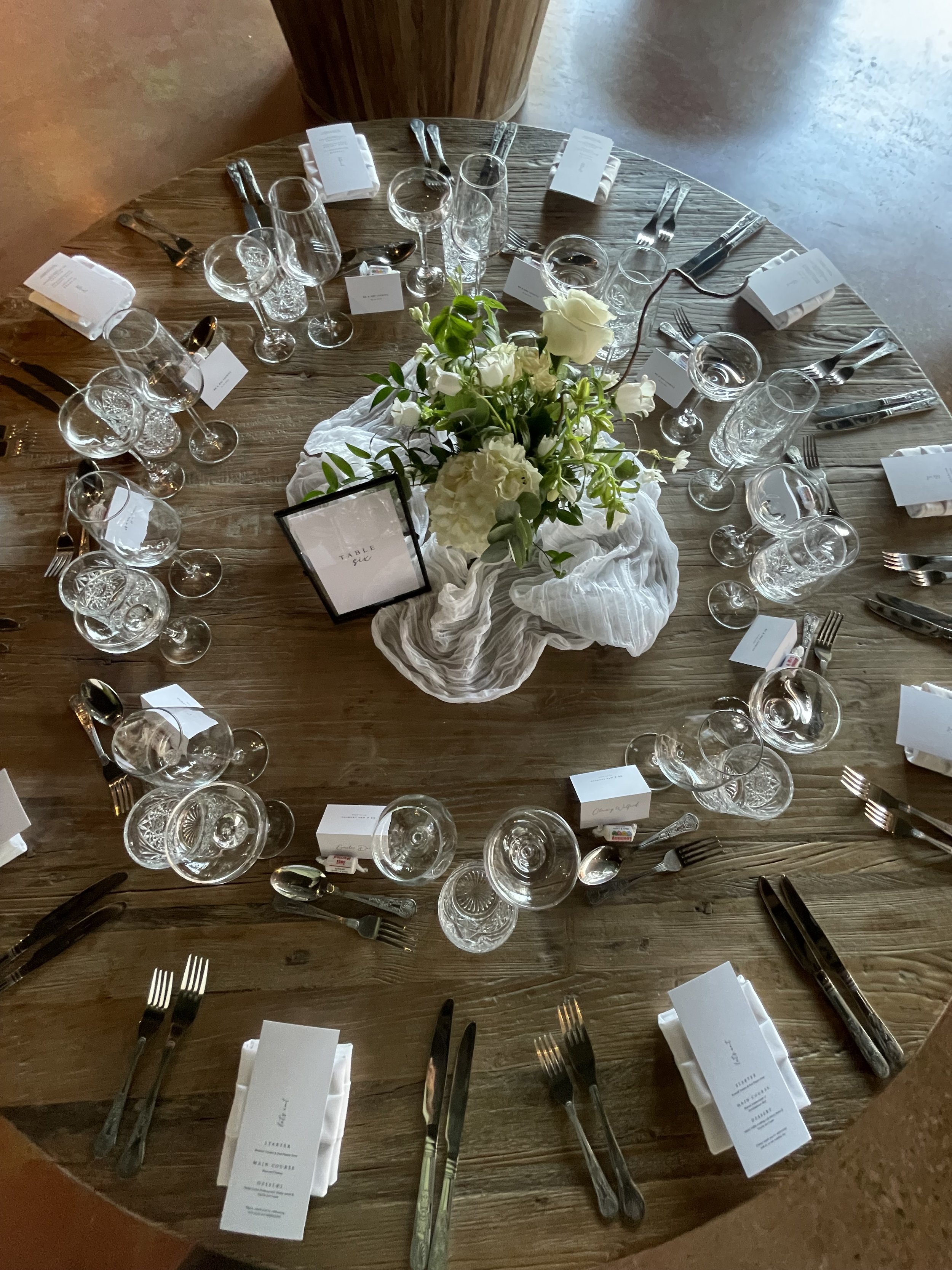 Floral bowls and muslins to soften and elevate the reception tables