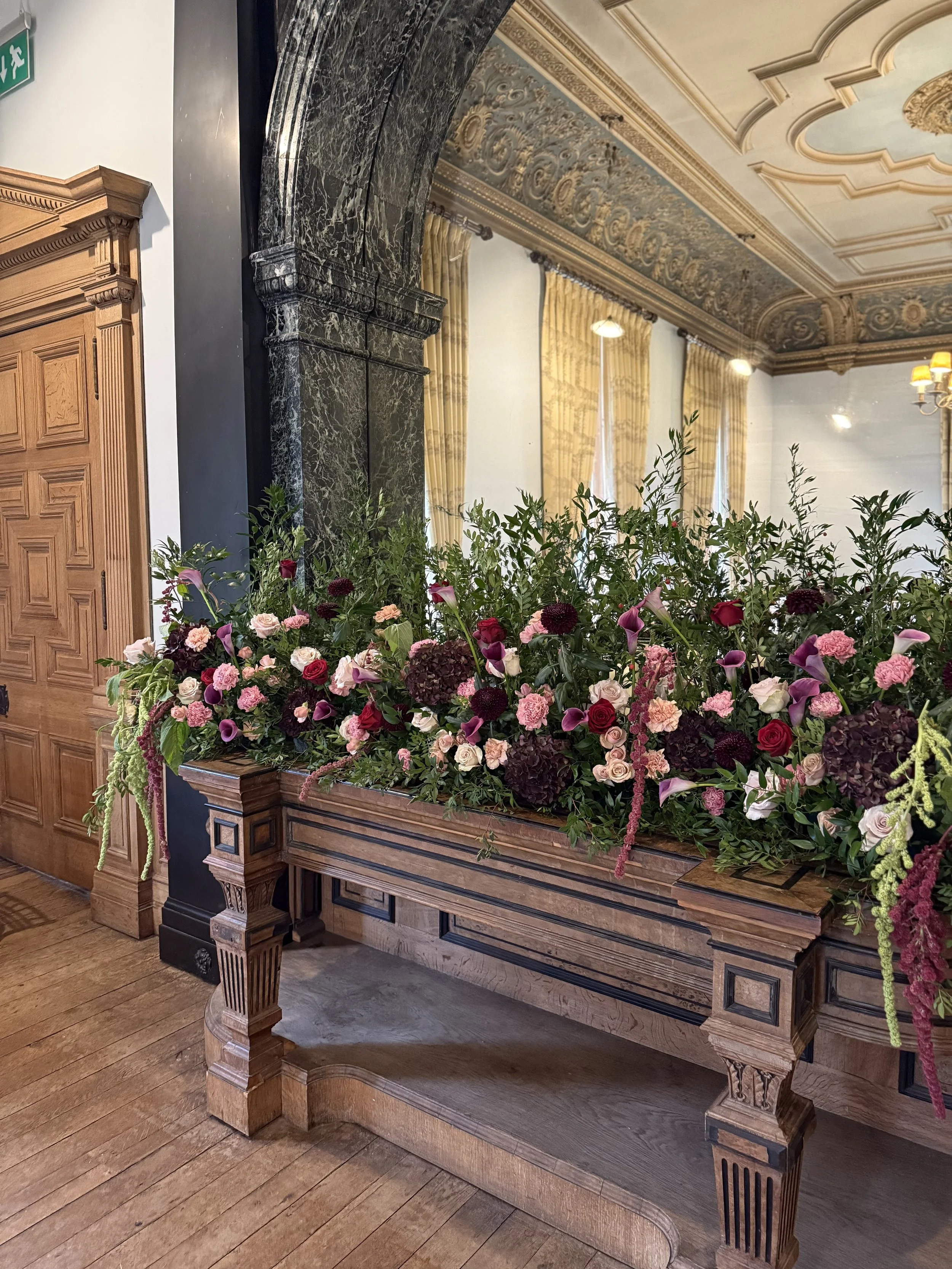 Large-scale floral installation as a ceremony backdrop