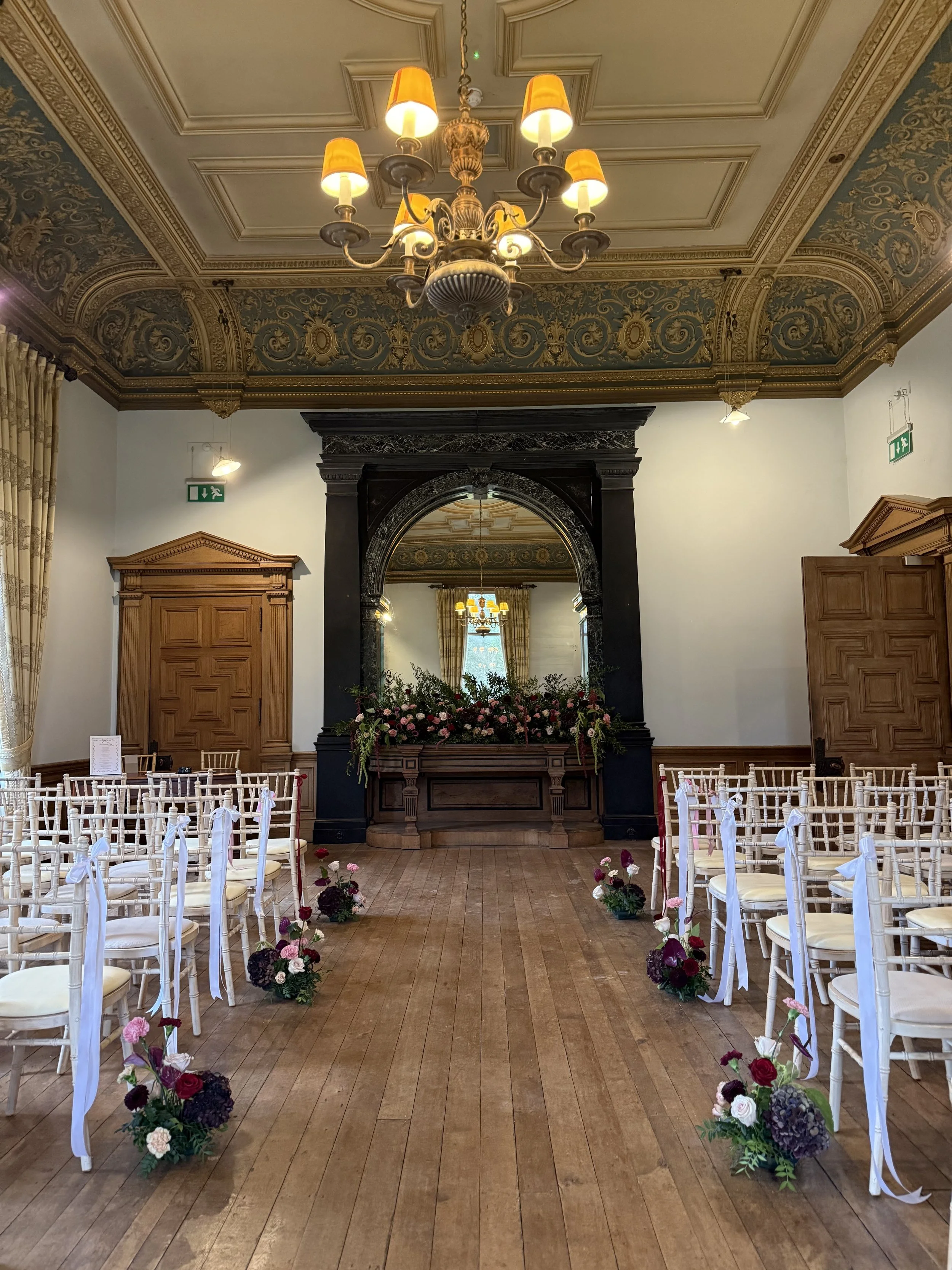 Floral clouds on the aisle later used as table centres