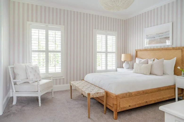 This girls&rsquo; bedroom radiates charm with each detail carefully considered. The soft, striped wallpaper serves as the focal point, layered with textures + prints that add depth + personality ✨

Interior Designer: @ellennicolehome 
Photographer: @