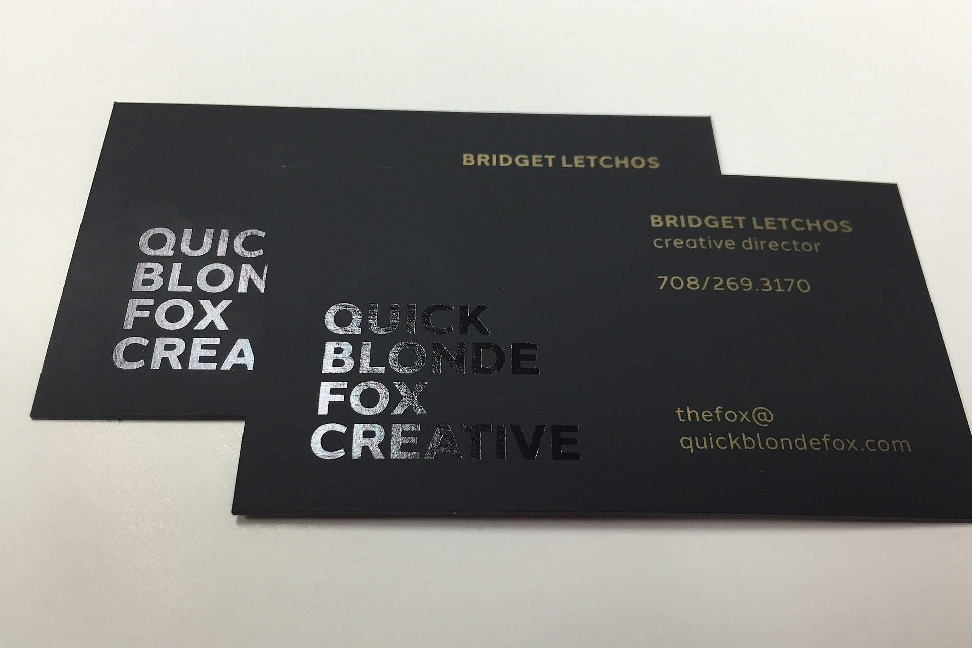 Simple and modern black business cards with matte and gloss finishing effects to create a monochromatic look