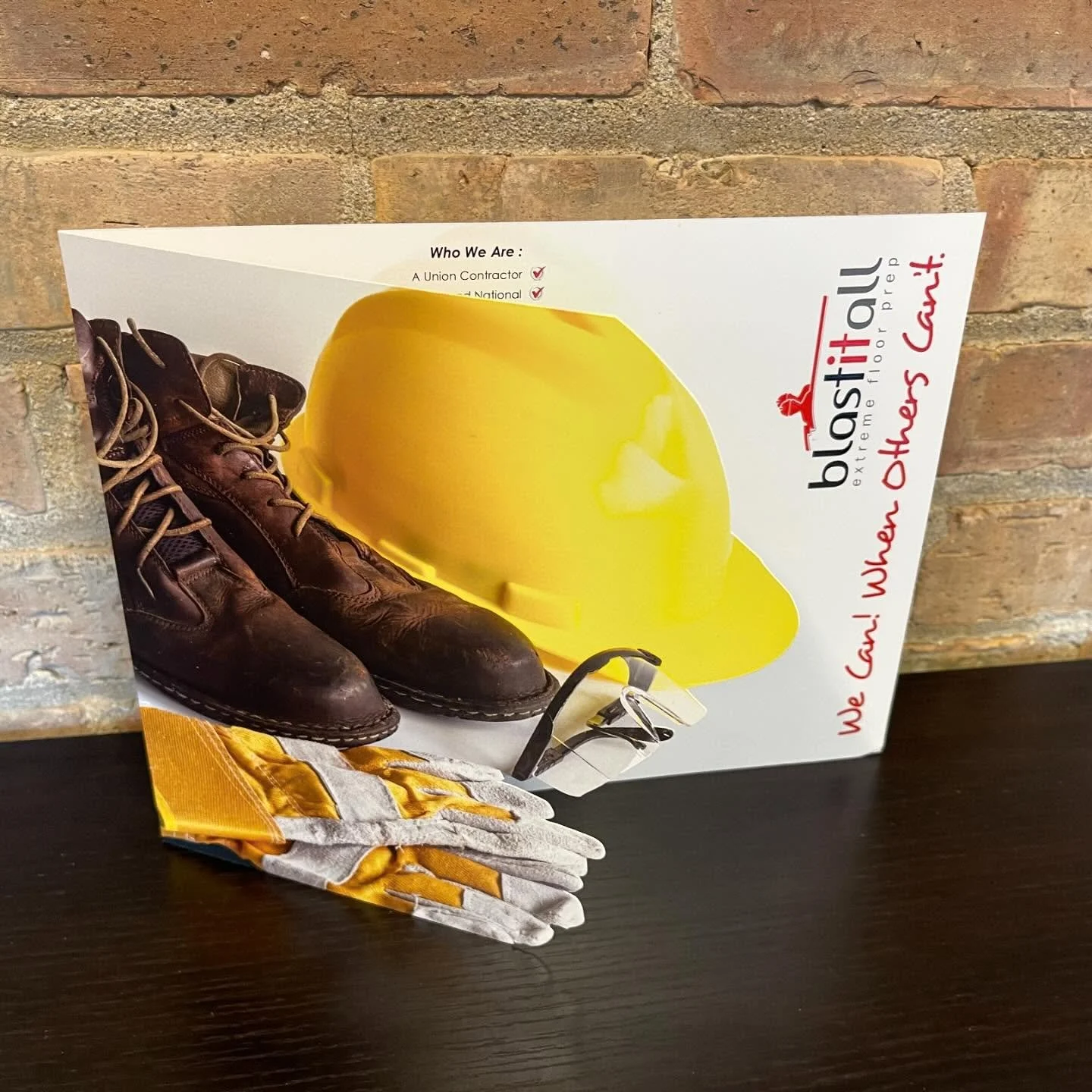 Blastitall Extreme Floor Prep Custom Brochure with a Custom Shaped front cover contour cut in the same of a construction hat, work boots and gloves.