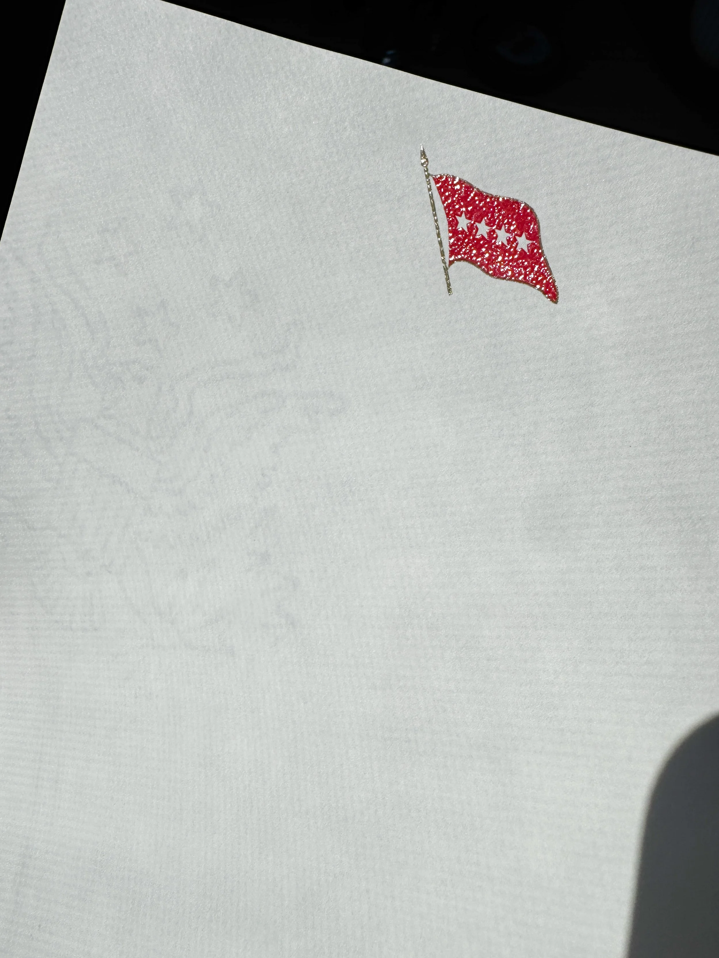 Official Government Stationary with a Raised Ink Flag in Red at the top