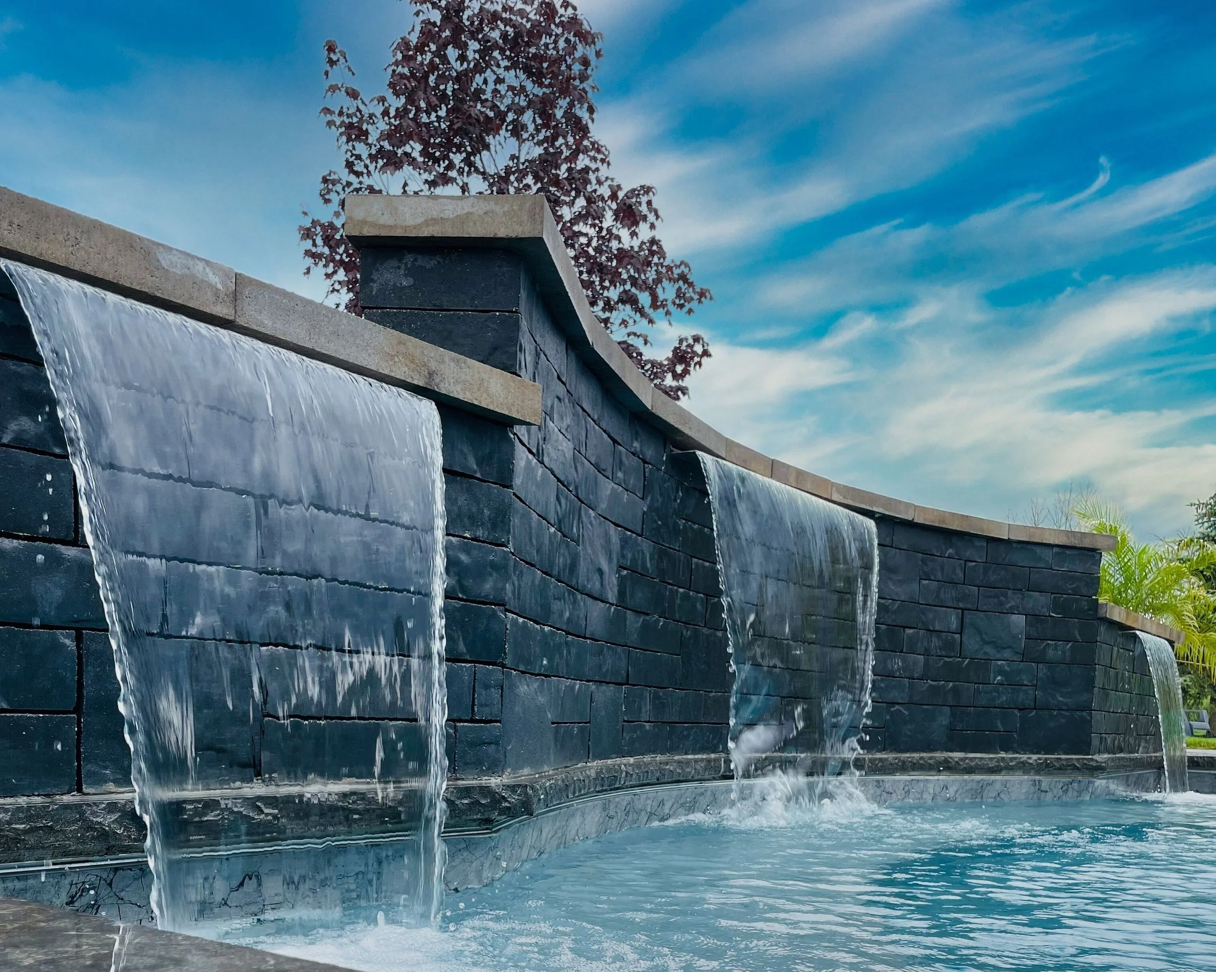 Techo-bloc stone retaining wall water feature.