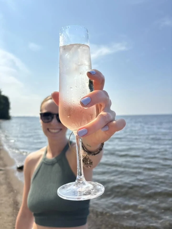 Bay Events staff, Hillary, promoting bartending services on a local beach