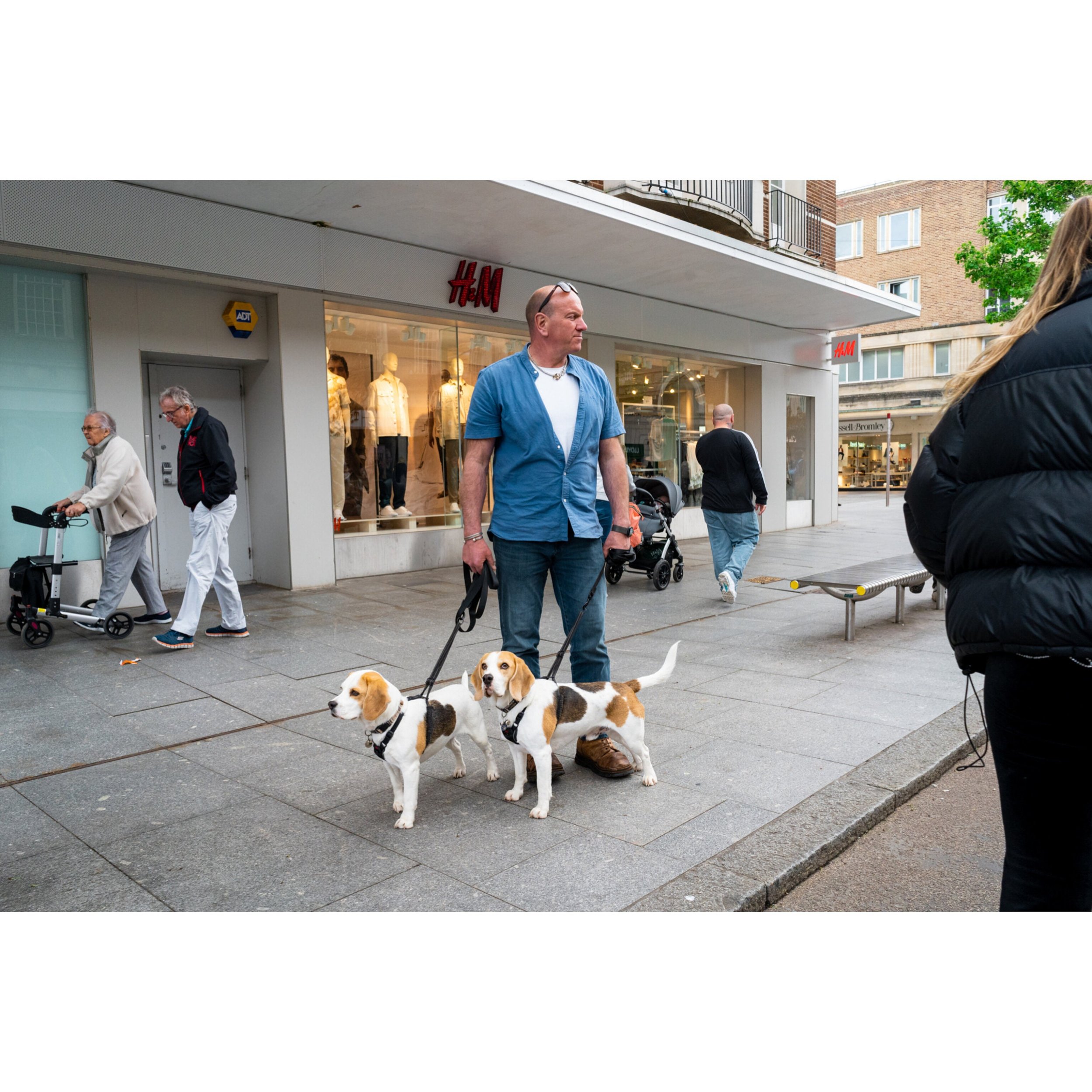 Man with two dogs example of Dogs on the Streets Zine by Abdullah Chakmakchi