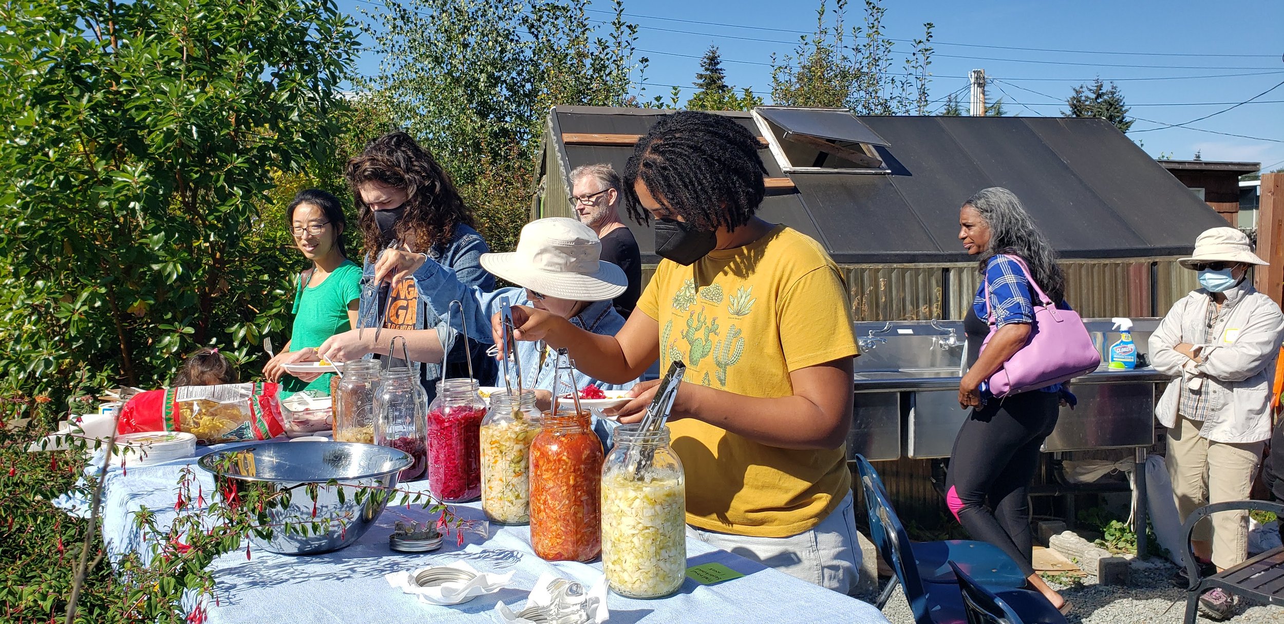 A group of people enjoying food at a class
