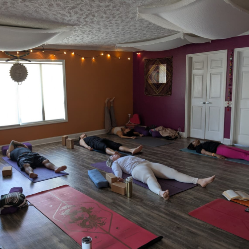 group yoga practicing yoga therapy