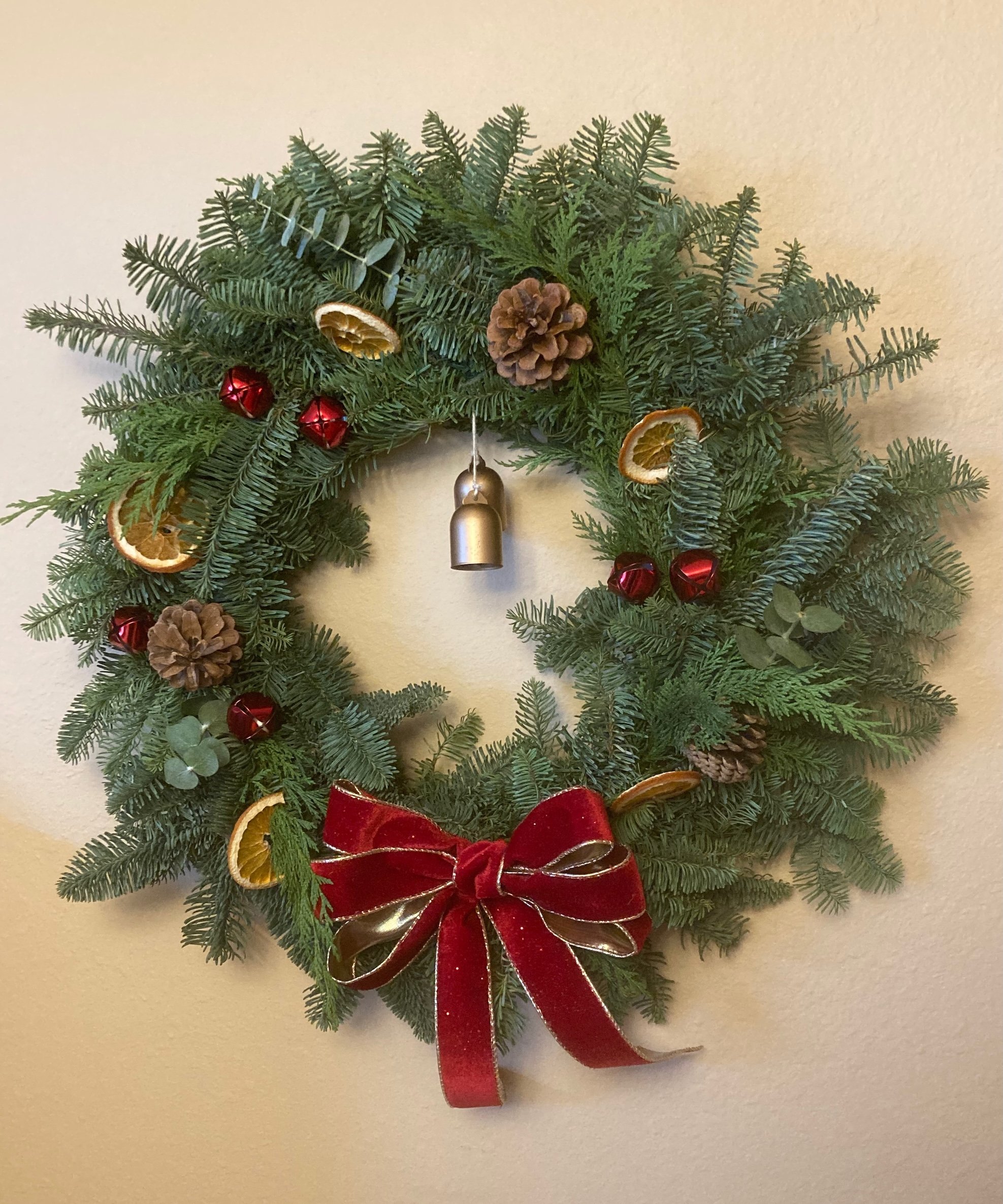 Wreath with red velveet bow.jpeg