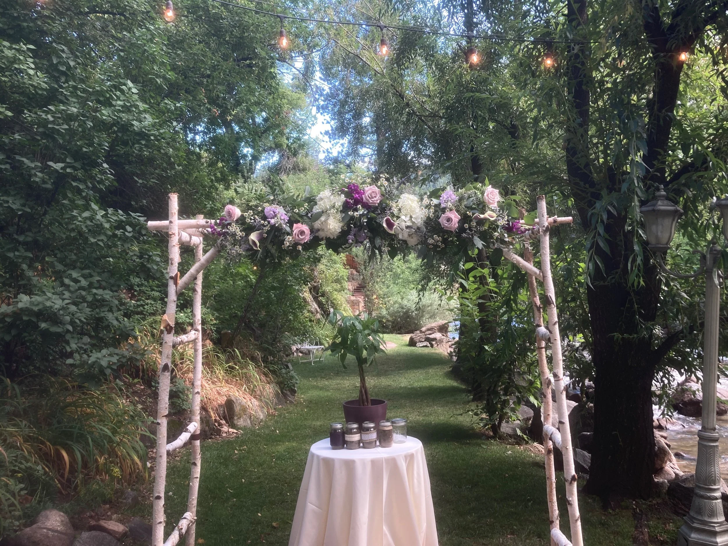 Purple wedding arch flowers