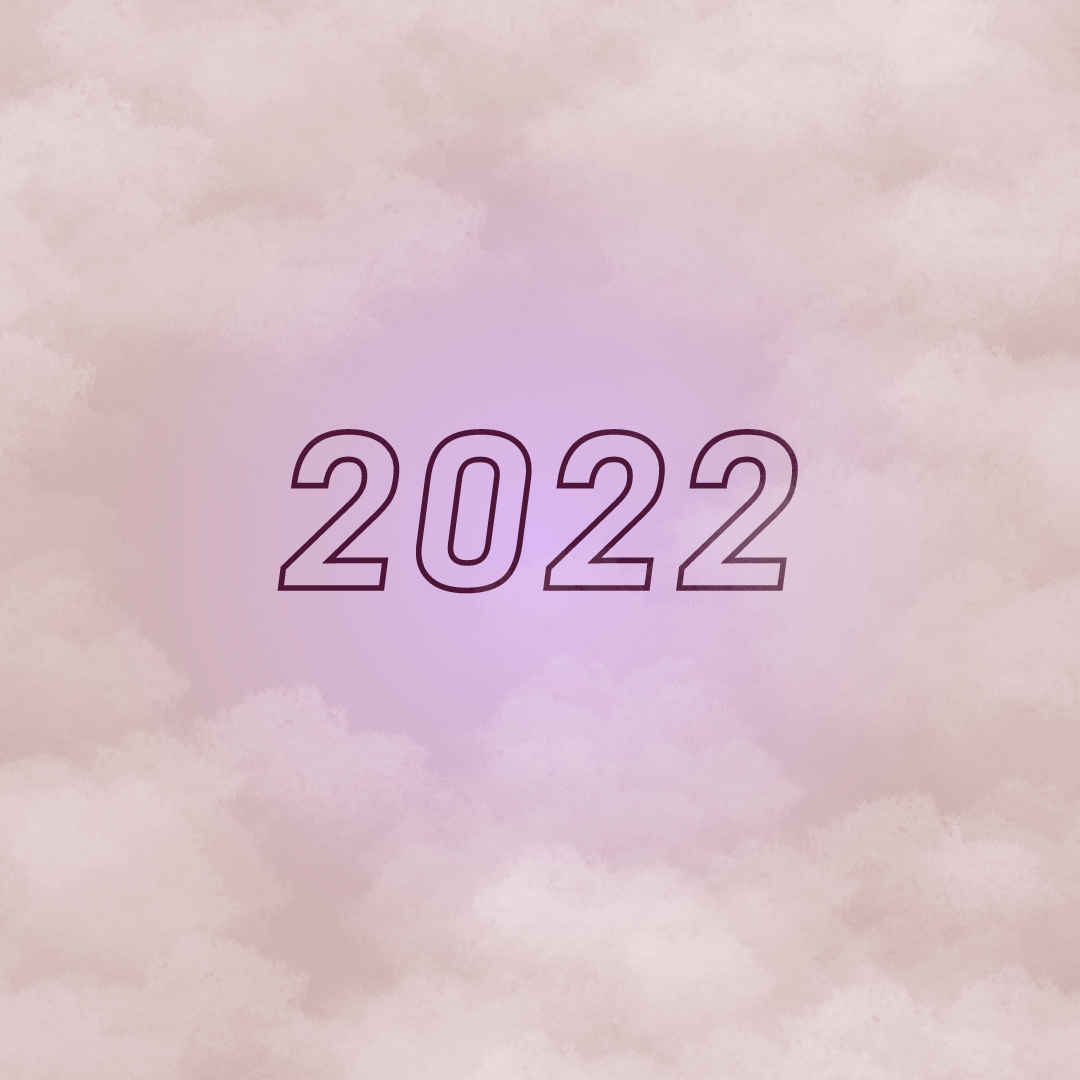 Soft pastel-colored clouds background with the year 2022 written in large, outlined purple numbers in the center.