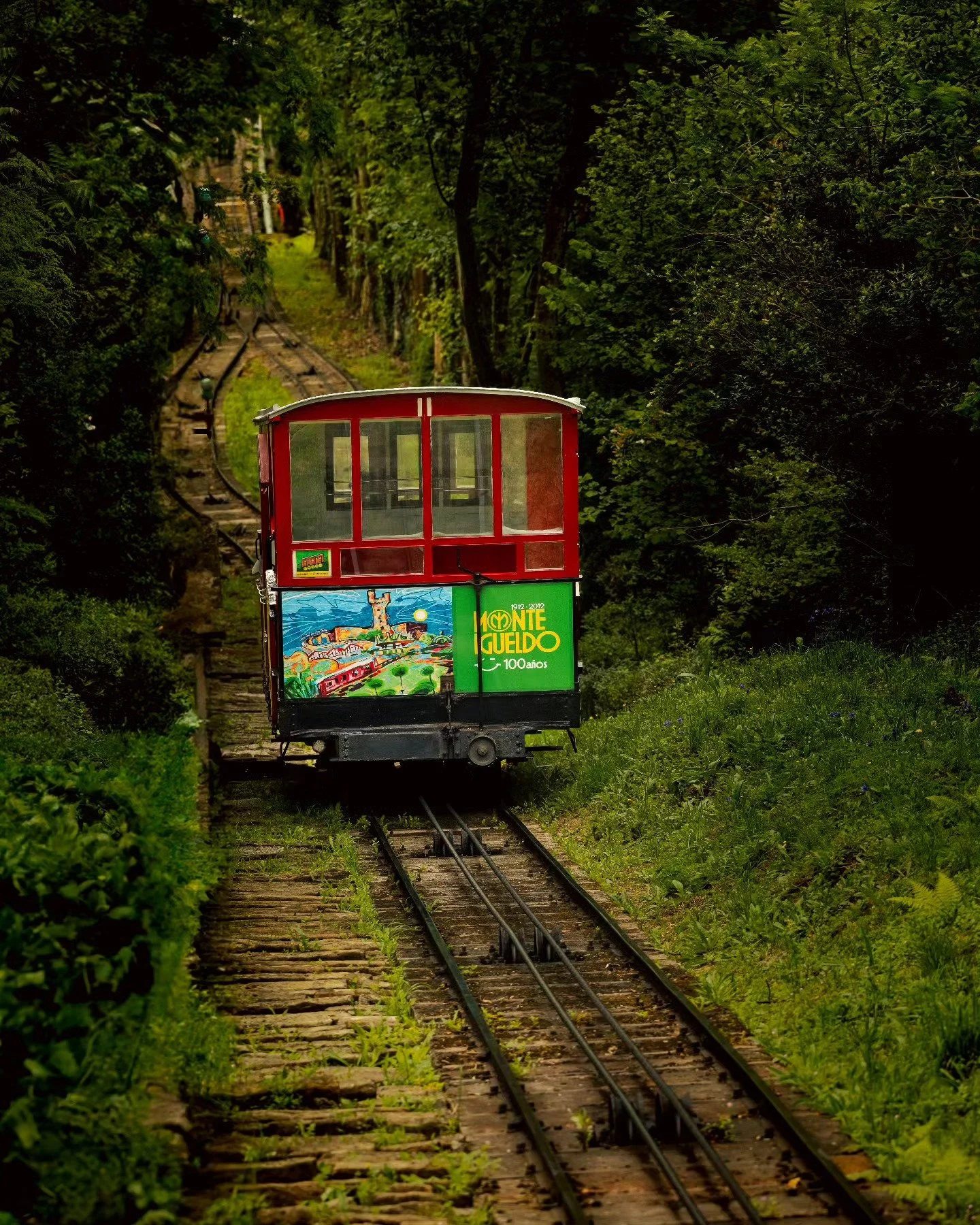 🚠 Monte Igueldo: where the journey is as iconic as the view.

The Monte Igueldo Funicular is more than just transportation; it is a masterclass in climbing with style. A funicular, for the uninitiated, is a cable railway built for steep inclines. It
