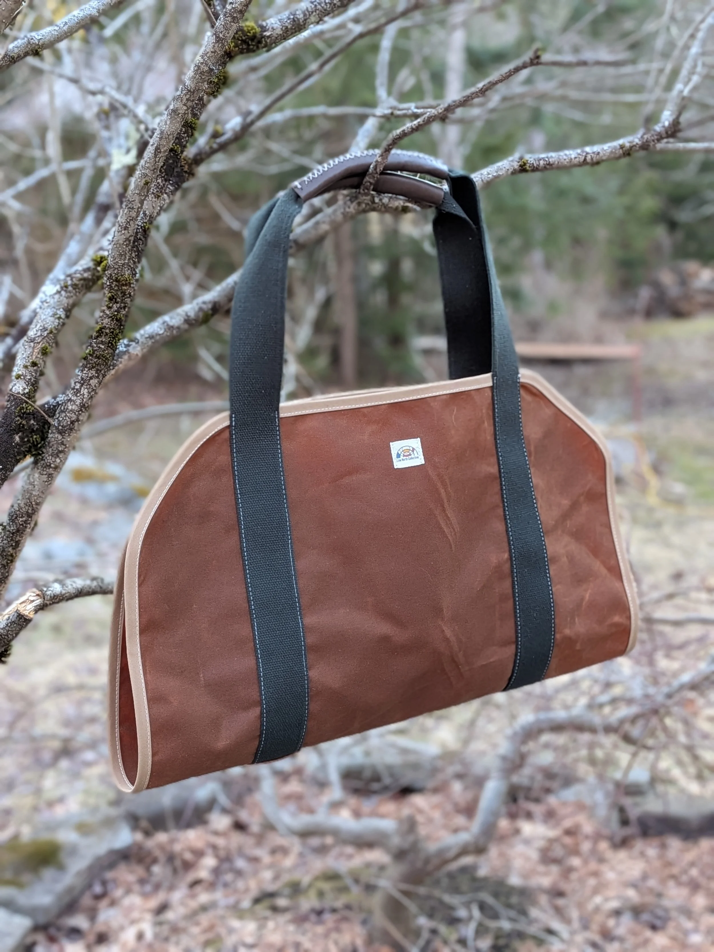 Waxed canvas textiles wood carrier handstitched leather handles for charity