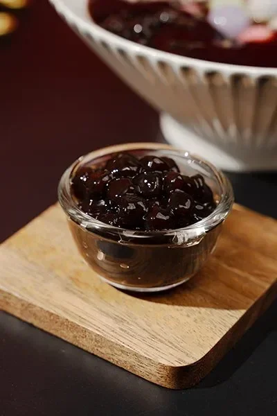 Brown sugar tapioca pearls in a glass cup, classic topping for milk tea and flavored drinks