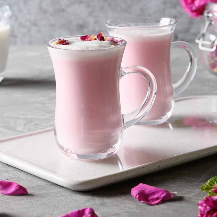 Rose drink in pink hue with flower petals – dreamy and photogenic beverage.