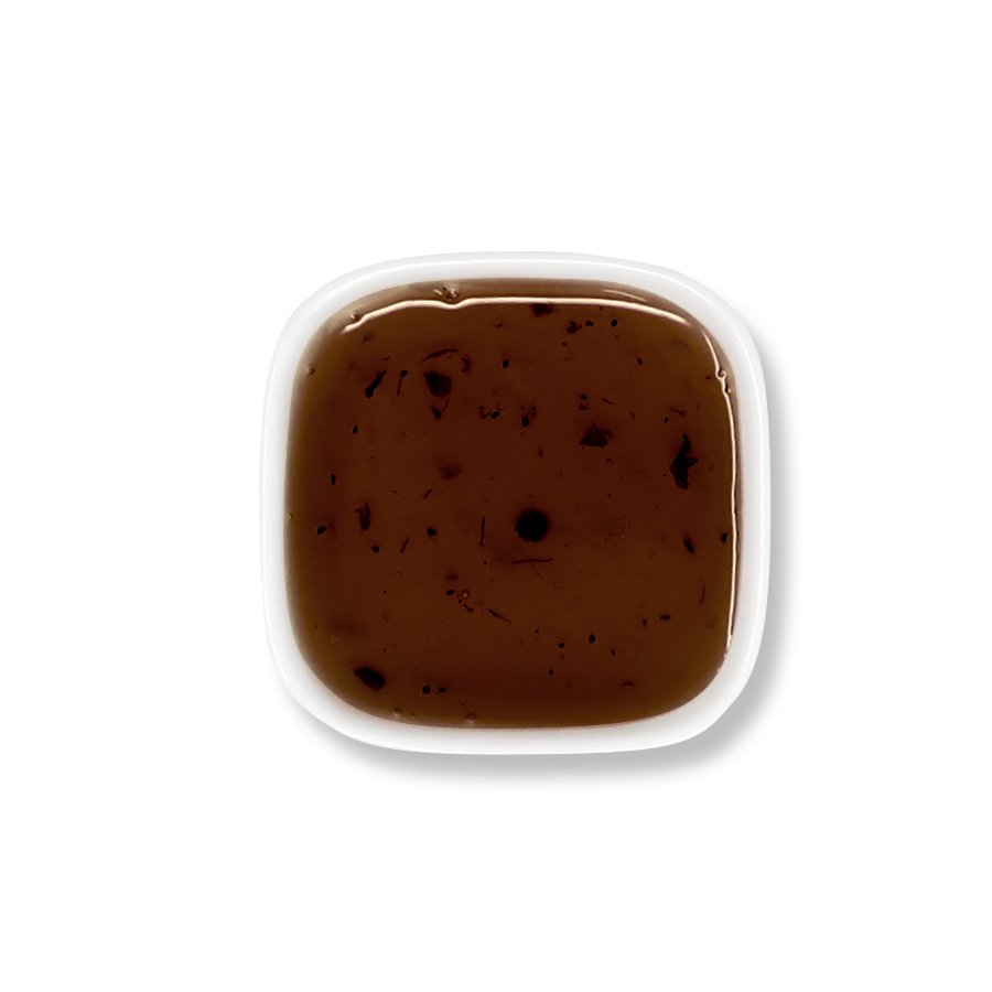 Top view of blueberry syrup – visible pulp and rich purple-red tone.
